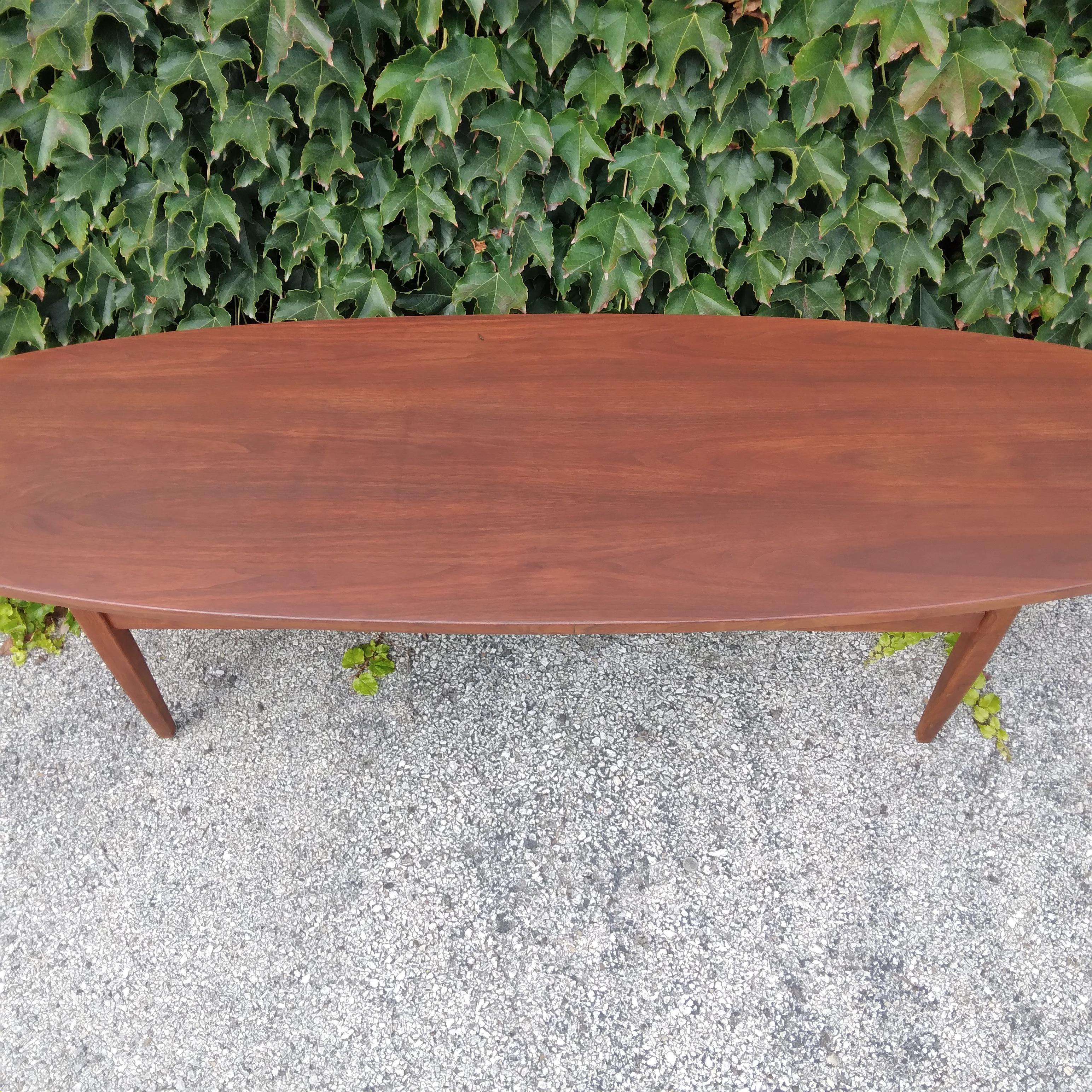 Solid wood in a swanky oval shape… this vintage coffee table is ready for your Mid-Century Modern home. We love her organic grain, enhanced by her long, slender lines. She is newly refinished with fresh stain and finish for durability. Lightweight,