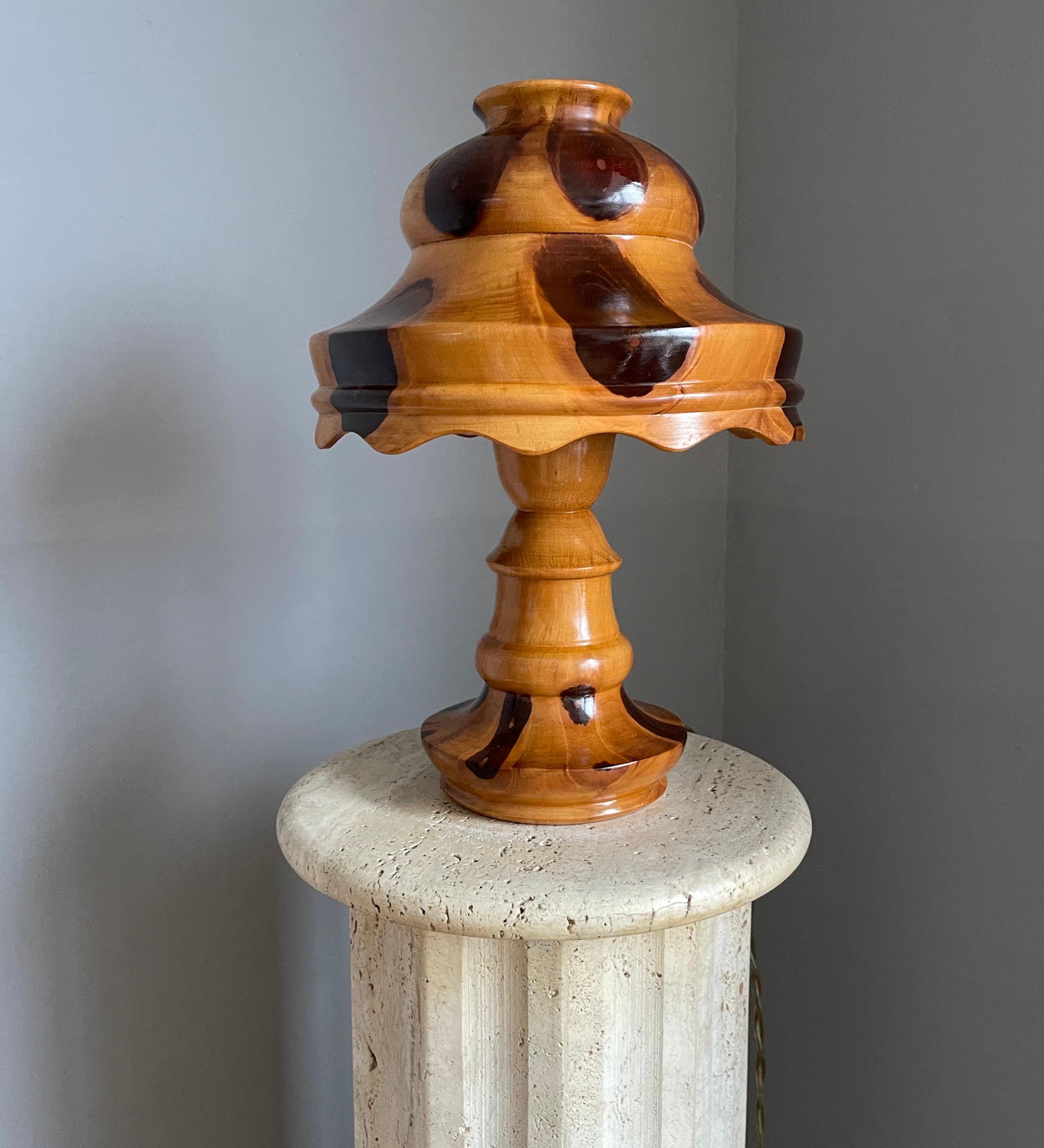 Beautiful shape, organic wooden table lamp with all natural colors and nice scalloped edge shade.

This midcentury era, mushroom shape table lamp has some of the most beautiful, natural colors you will ever see. We don't know what type of wood this