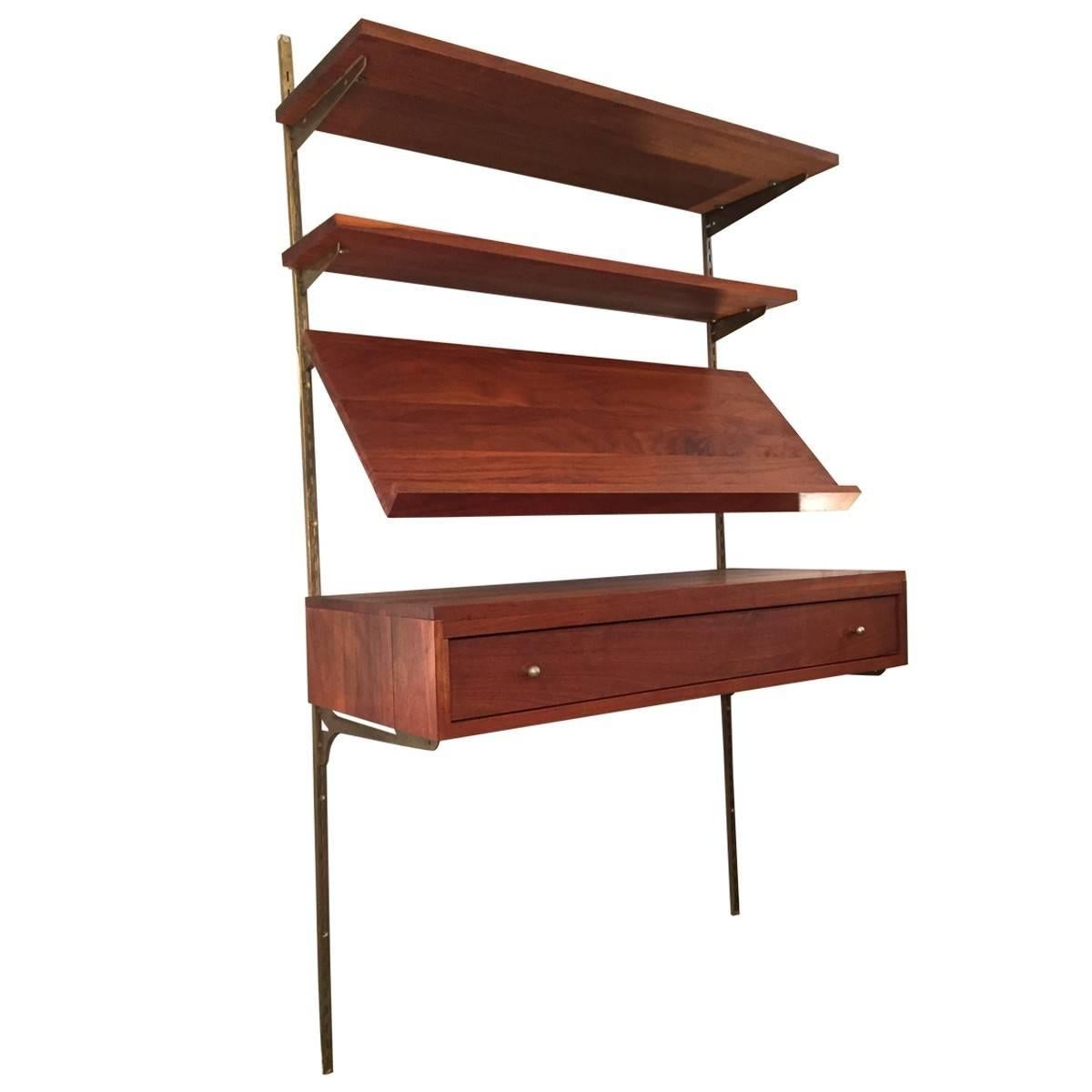 Mid-Century Modern Woodland Furniture was started in 1996 by Lynn and Pat Harker, in Idaho Falls to serve the interior design community with high-quality products. This unique adjustable wall unit deconstructs the traditional elements of a classic