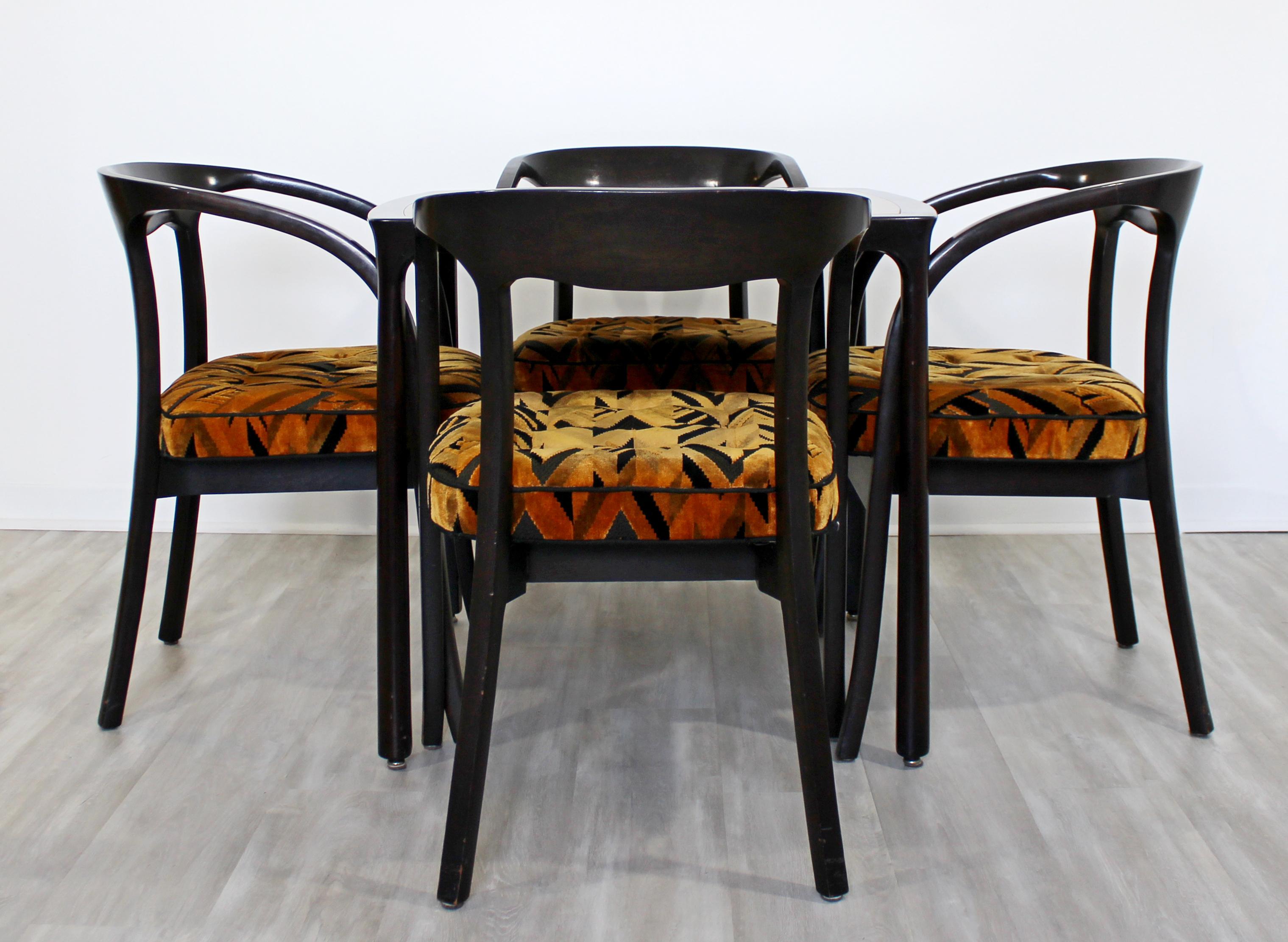For your consideration is an extravagant game or dinette set, including a mahogany and rosewood table and four matching armchairs, by Edward Wormley for Dunbar, circa 1970s. The upholstery is Tressard very reminiscent of Jack Lenor Larsen. Cushions