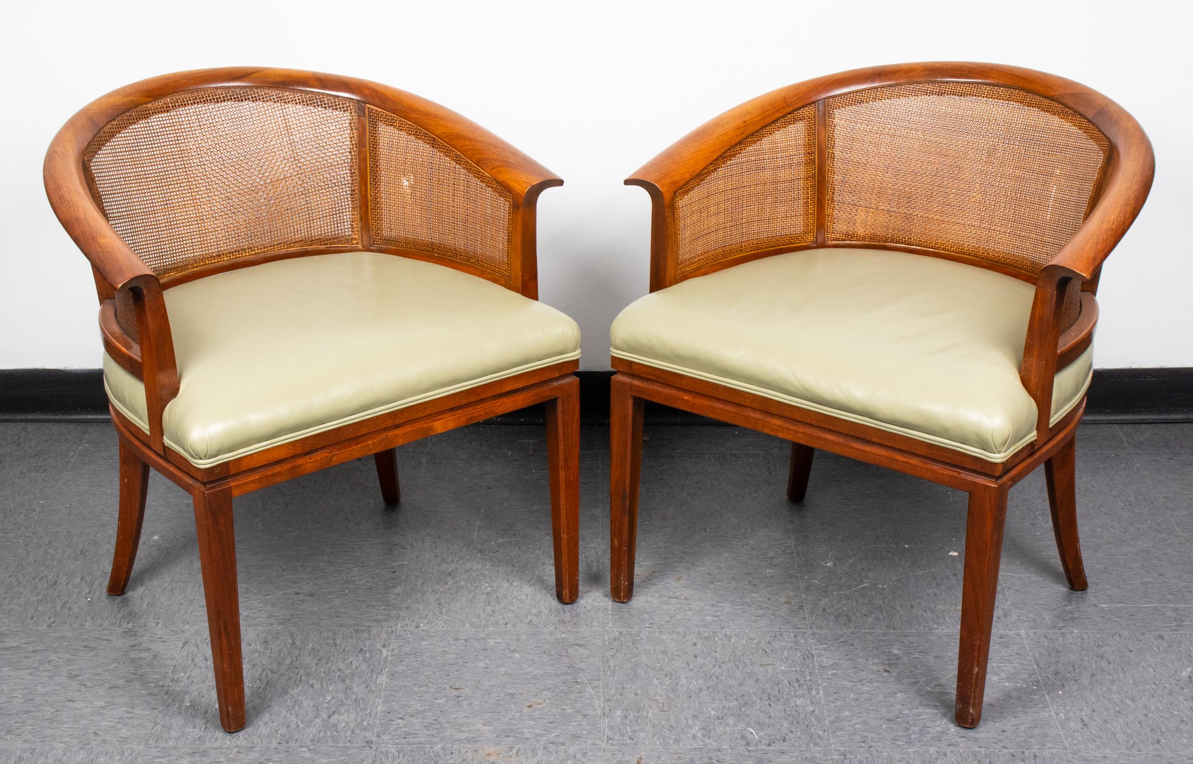 Pair of Edward Wormley style Mid-Century Modern armchairs with caned barrel backs, upholstered cushions. Measures: 29