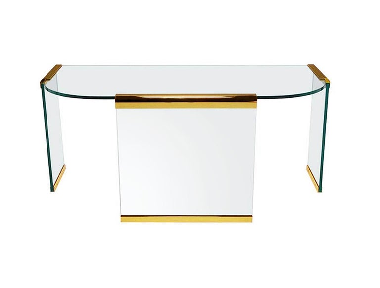 A stunning simple and elegant modern design by Leon Rosen and produced by Pace in the 1980's. It features heavy thick 3/4 inch glass construction with polished brass brackets and end caps.