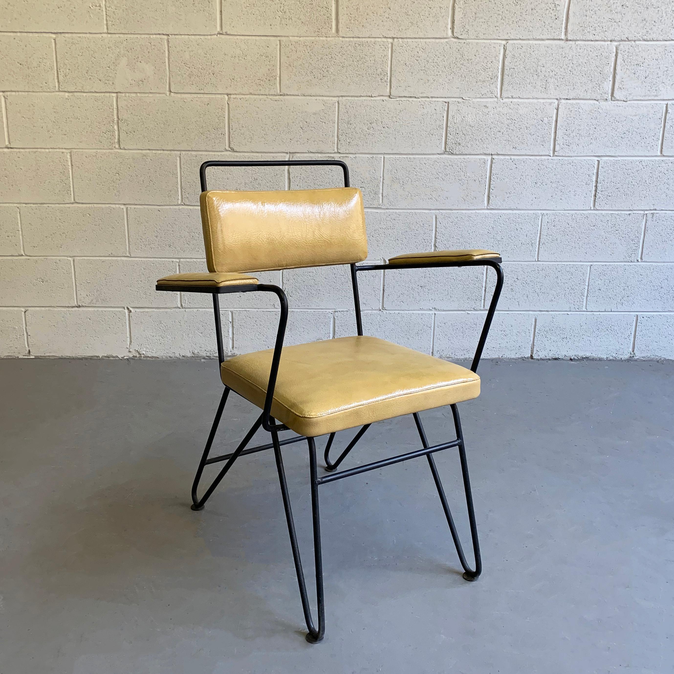 Outstanding, Mid-Century Modern armchair attributed to Dan Johnson for Pacific Iron features a highly-stylized, wrought iron frame with mustard, crinkled, patent leather upholstery. A unique, single stitch upholstery technique accentuates the