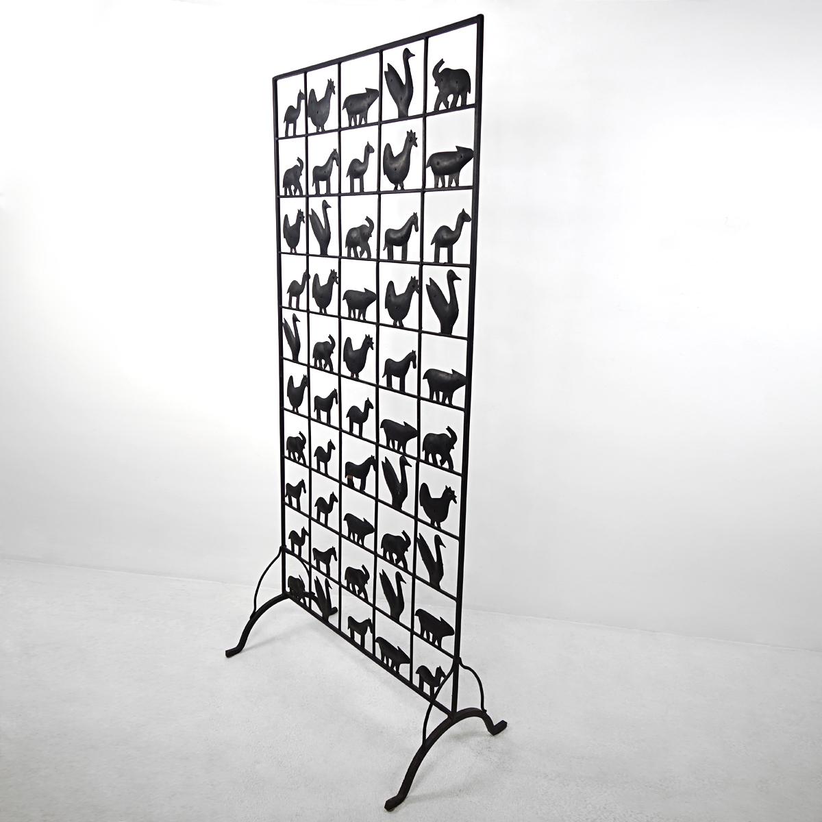 Very decorative screen or room divider made by hand Atelier de Marolles in the 1950s. 
The screen is made of wrought iron and is decorated with 50 animal figurines.