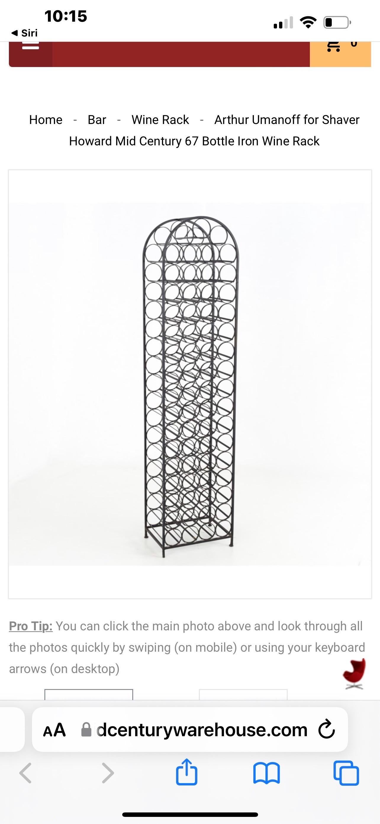 Mid Century Modern Wrought Iron Wine Rack by Arthur Umanoff 
This free standing 67 bottle rack was Manufactured by Shaver Howard 
It Measures: 72
