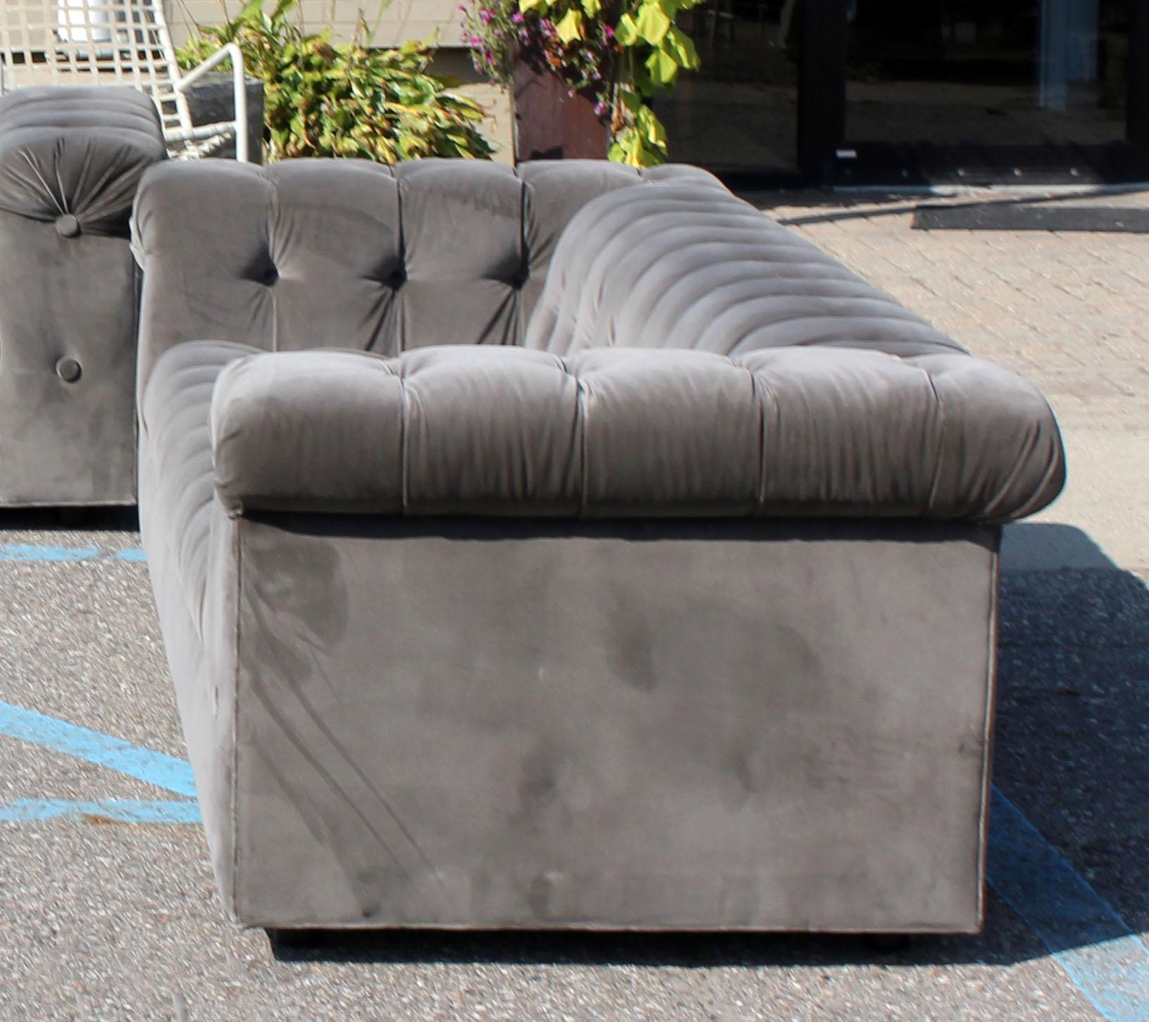 For your consideration is a fabulous x-long party sofa, with a tufted, gray velvet upholstery, by Dunbar. In excellent condition. The dimensions are 98
