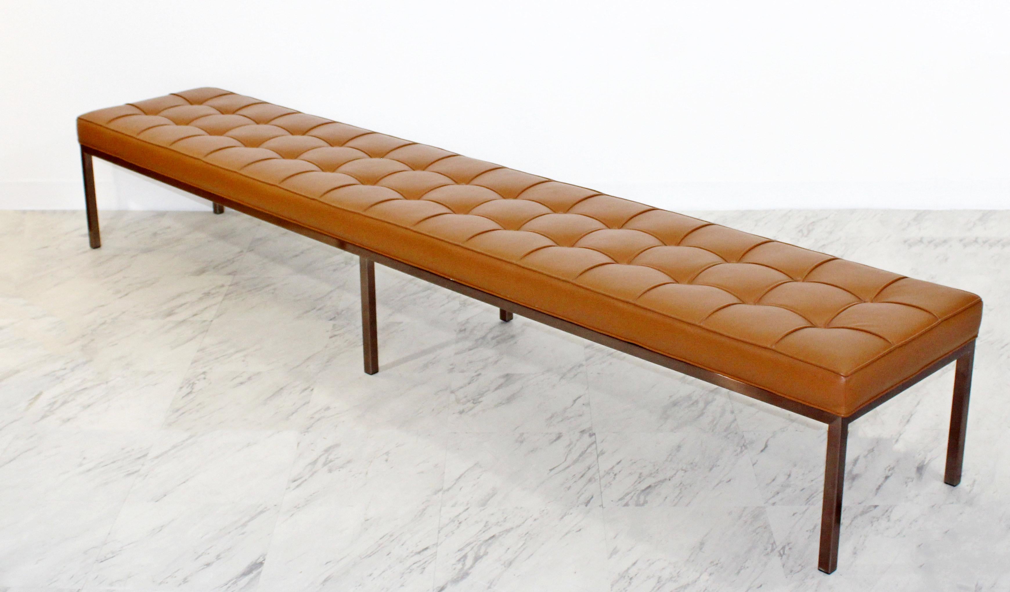 For your consideration is a marvelous X-long museum tufted cognac brown leather bench, on a bronze finished base, circa the 1970s. In excellent condition. The dimensions are 96