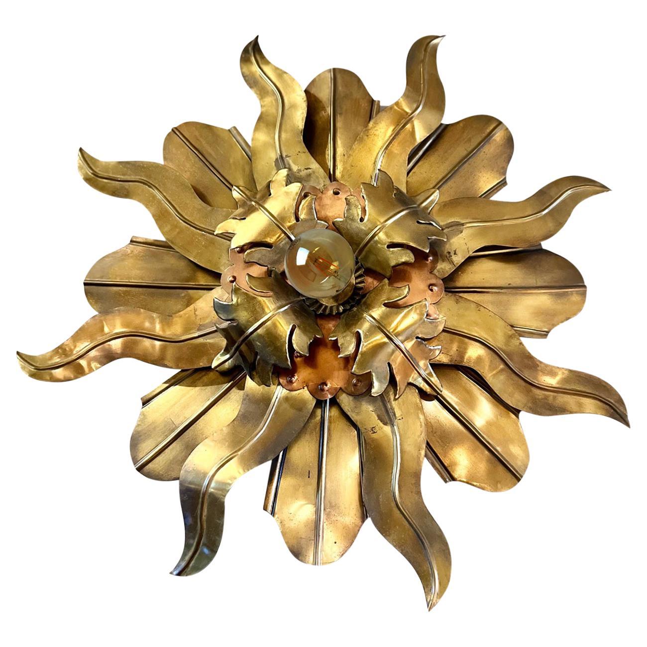 Eye-catching gilt wrought iron sunburst ceiling flush mount in the style of Brutalism. Manufactured in France, 1960s.
This hand-hammered kopper sunburst flush mount or wall sconce will be a nice mid century accent wherever you place it.
Gorgeous