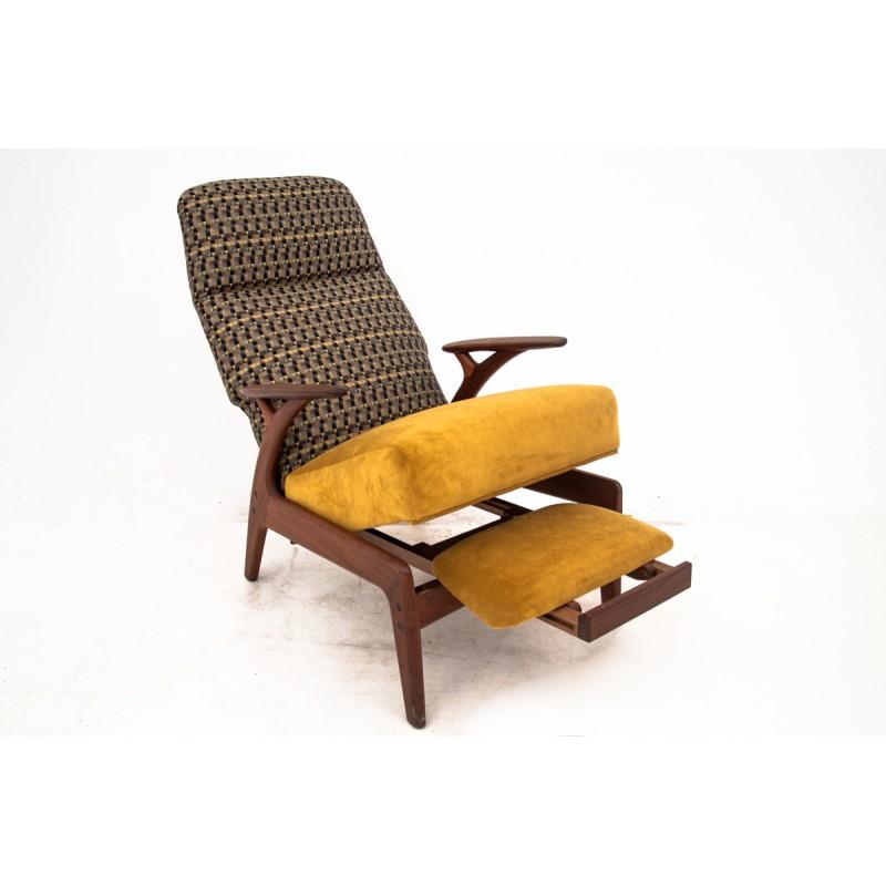 Unique retro armchair with pull-out footrest that can be easly hiden. 
Made in Denmark, in circa 1960.
 