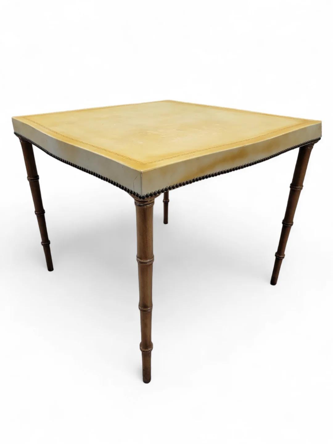 Mid Century Modern Tapered Bamboo Leg Game Table Upholstered in Canary Yellow Leather by Barnard & Simonds Furniture Co. 

This bamboo table is perfect for your rustic or coastal space. The table top is covered in a beautiful yellow leather, perfect