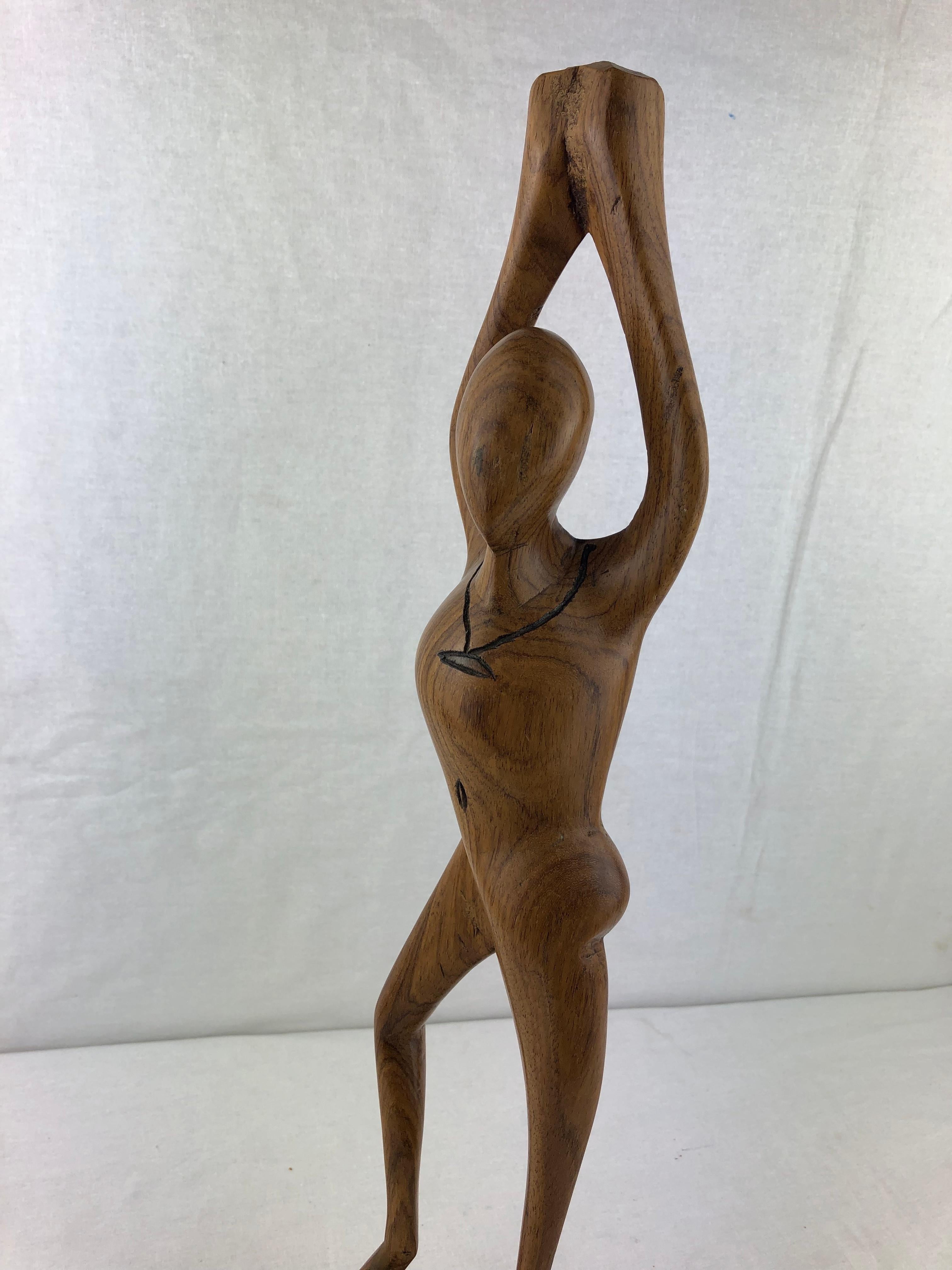 Beautiful organic modern hand carved wooden statue, figure in a pose. 

This statue has a wonderful patina and would be perfect for a yoga studio, meditation room or anywhere.