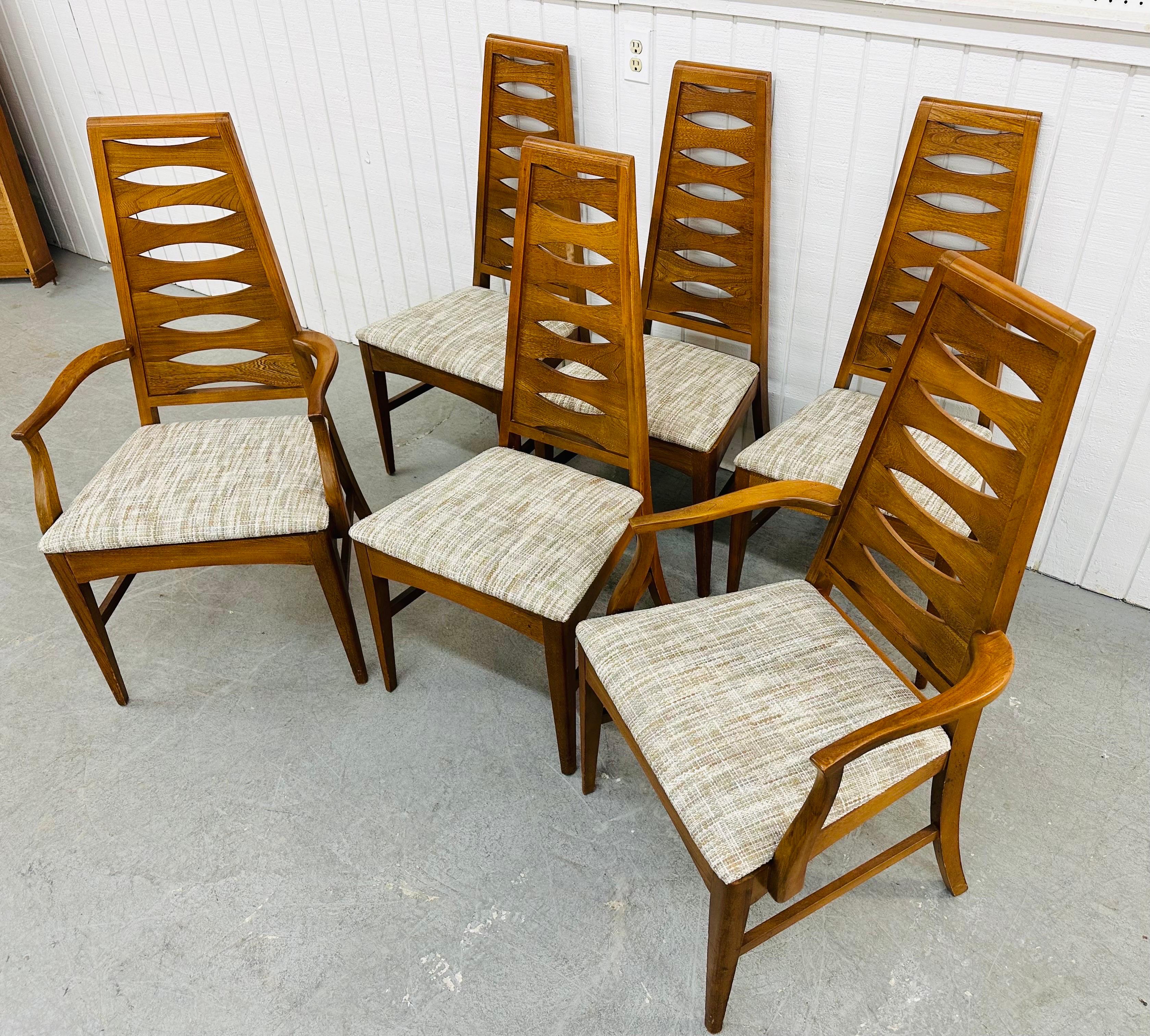 This listing is for a set of six Mid-Century Modern Young Manufacturing Walnut Catseye Dining Chairs. Featuring a high back catseye design, two arm chairs, four straight chairs, newly upholstered seats, and a beautiful walnut finish. This is an
