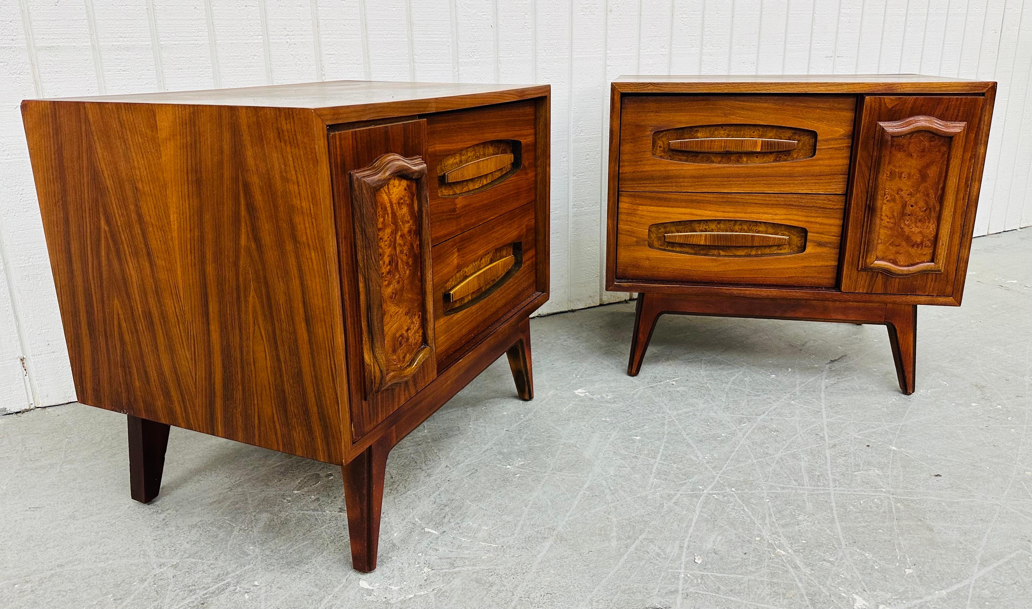 This listing is for a pair of Mid-Century Modern Young Manufacturing Walnut Nightstands. Featuring a straight line design, two drawers with wooden pulls, sliding door that reveals hidden storage space, modern legs, and a beautiful walnut finish.
