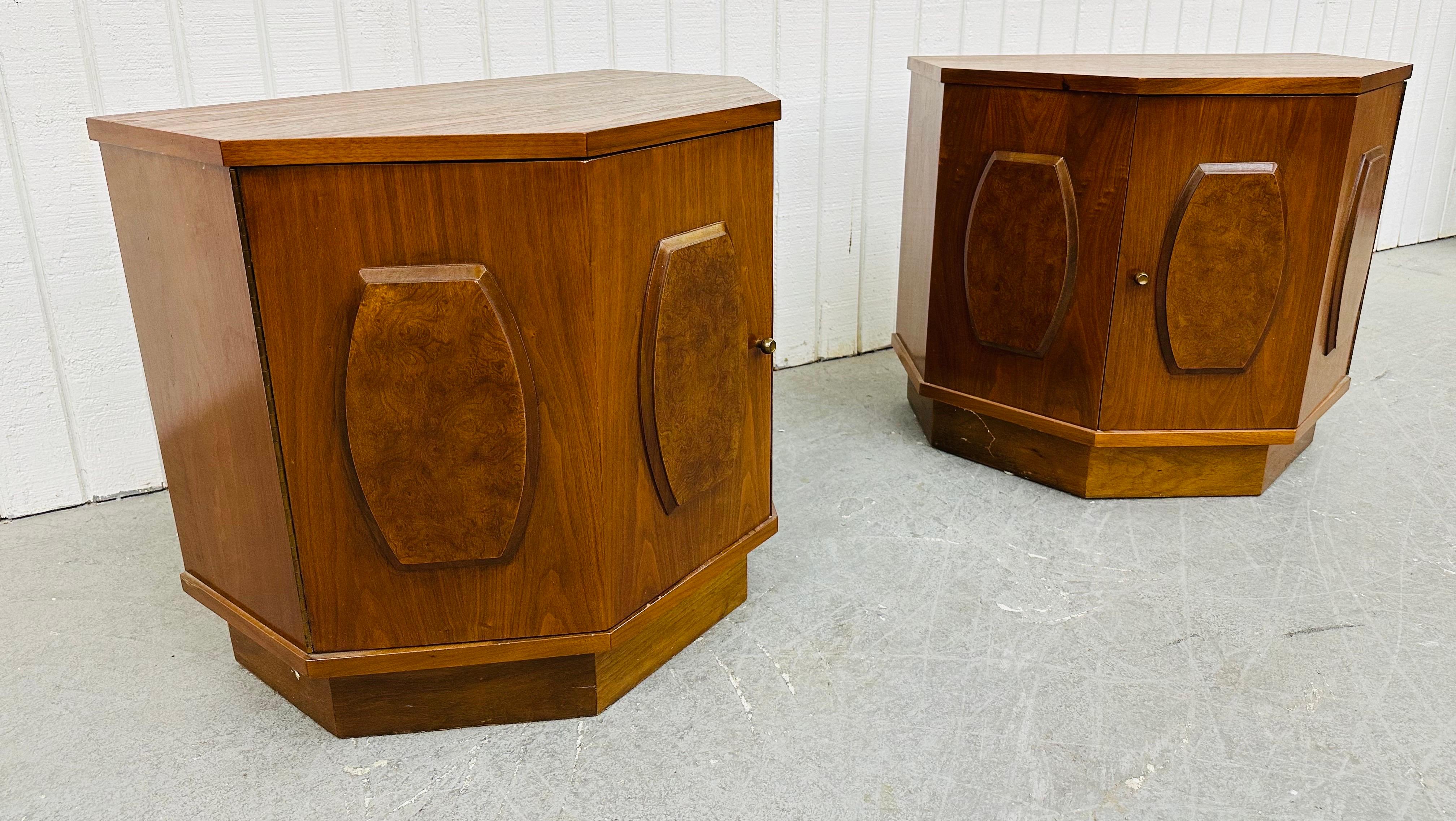 This listing is for a pair of Mid-Century Modern Young Manufacturing Walnut Nightstands. Featuring a straight line design, three burled wood panel fronts, single door with brass pull that opens up to storage space, plinth base, and beautiful walnut