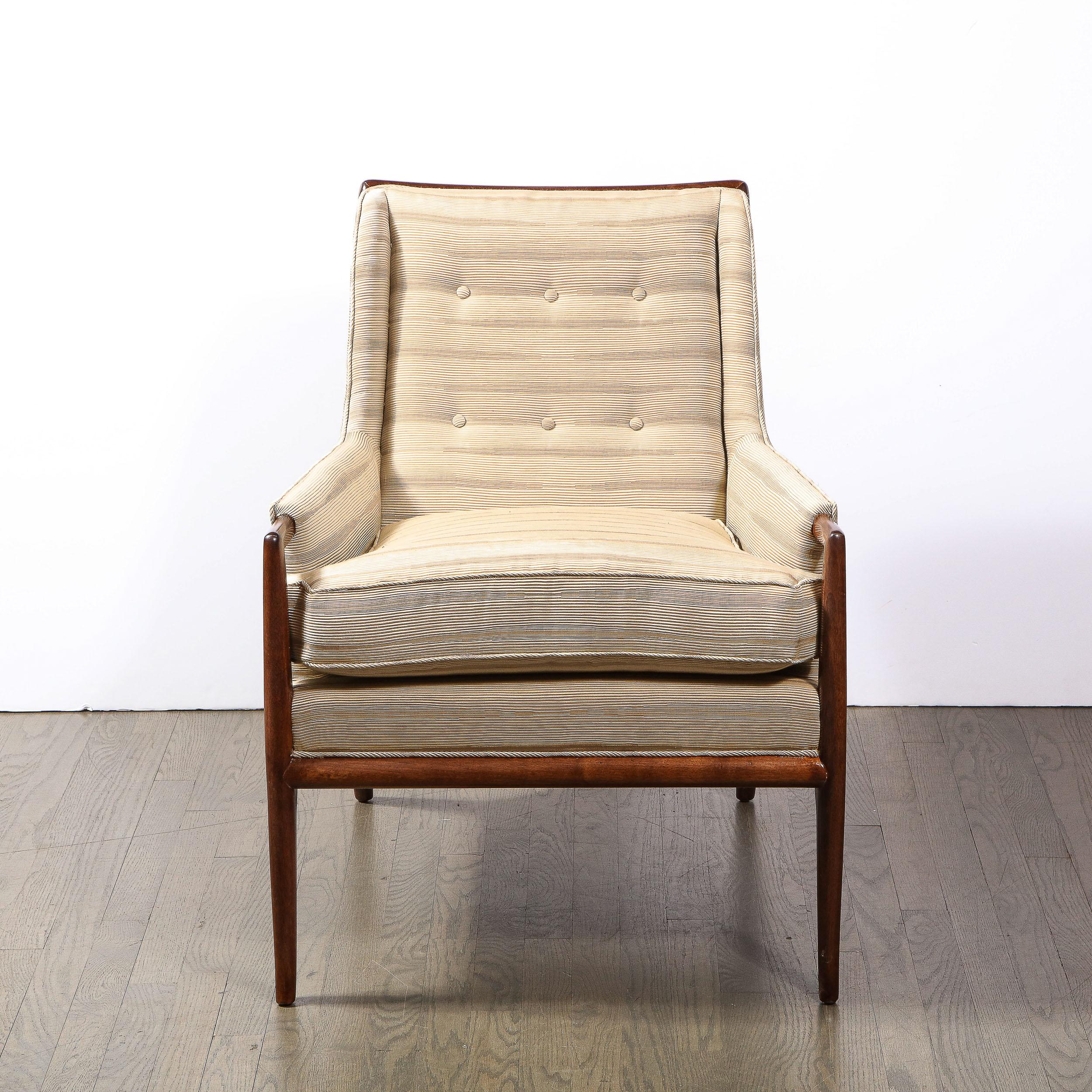 This effortlessly elegant and timeless Mid Century Modern chair was realized by the legendary designer T.H. Robsjohn-Gibbings in the United States circa 1950. Gibbings was renowned for assimilating classical influences into silhouettes that were