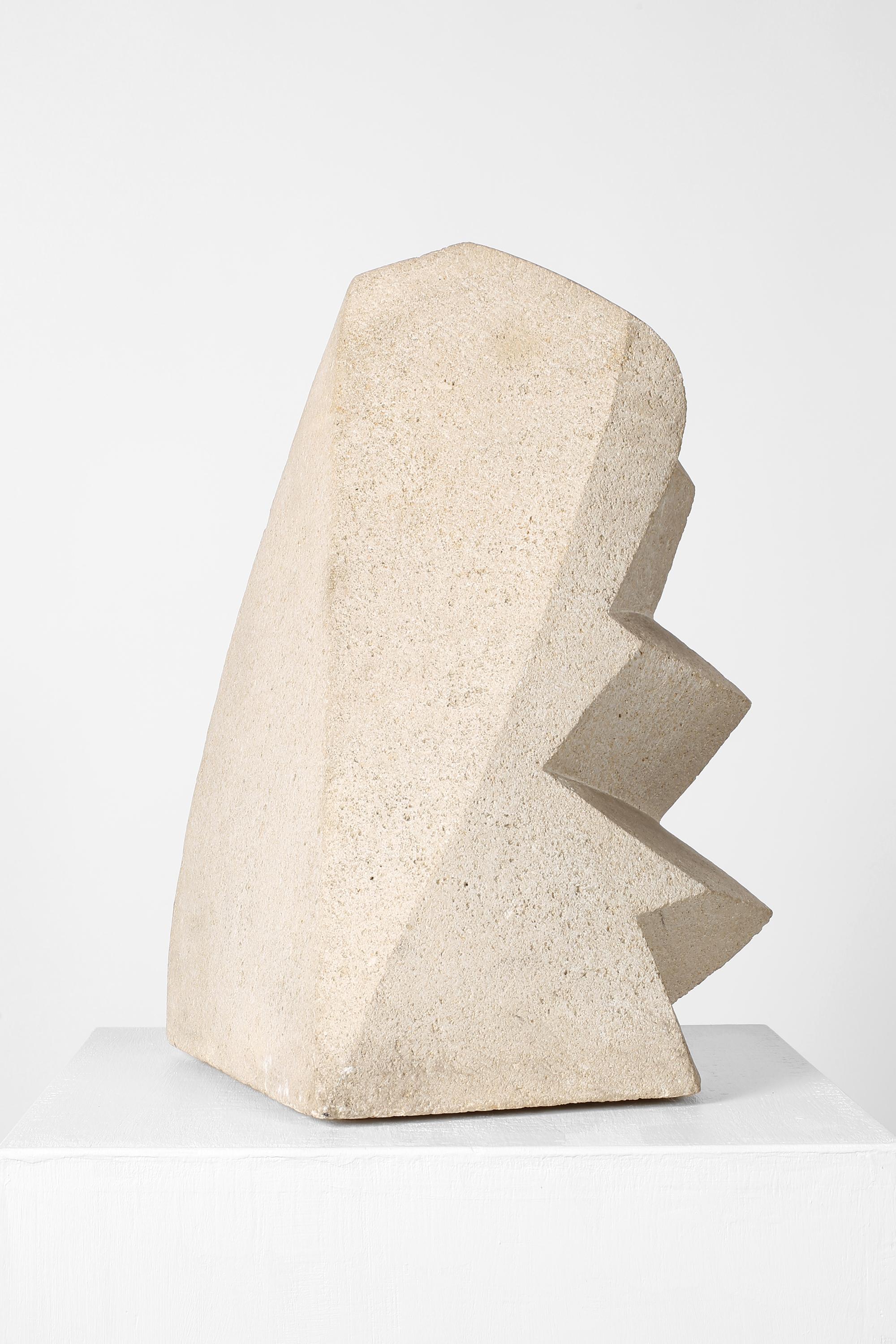 A bold, mid-20th century carved stone sculpture of angular, modernist form, signed ‘A. Tihen’.

Europe, c. 1960s.