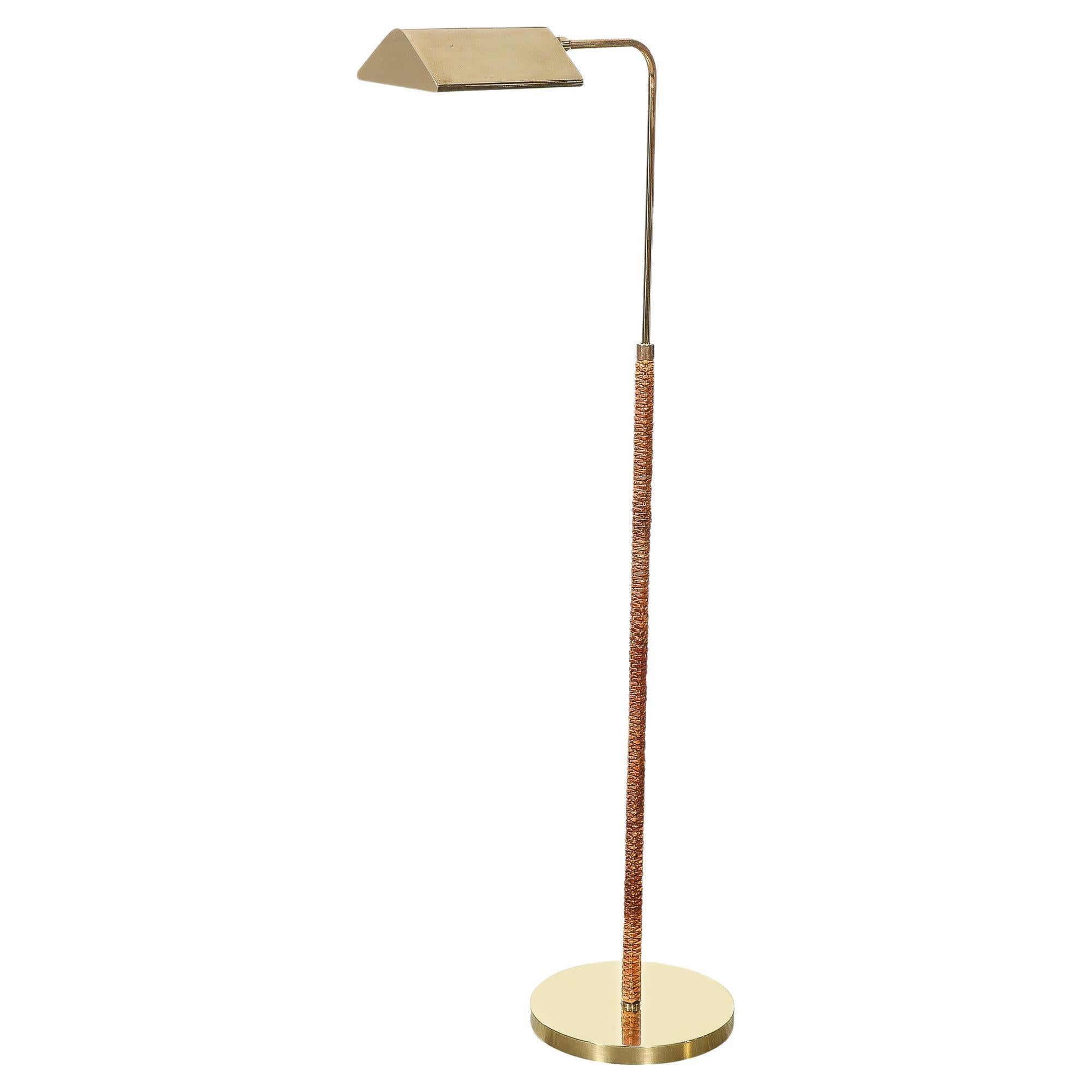 Mid-Century Modernist Articulating Polished Brass and Ratan Wrapped Floor Lamp For Sale