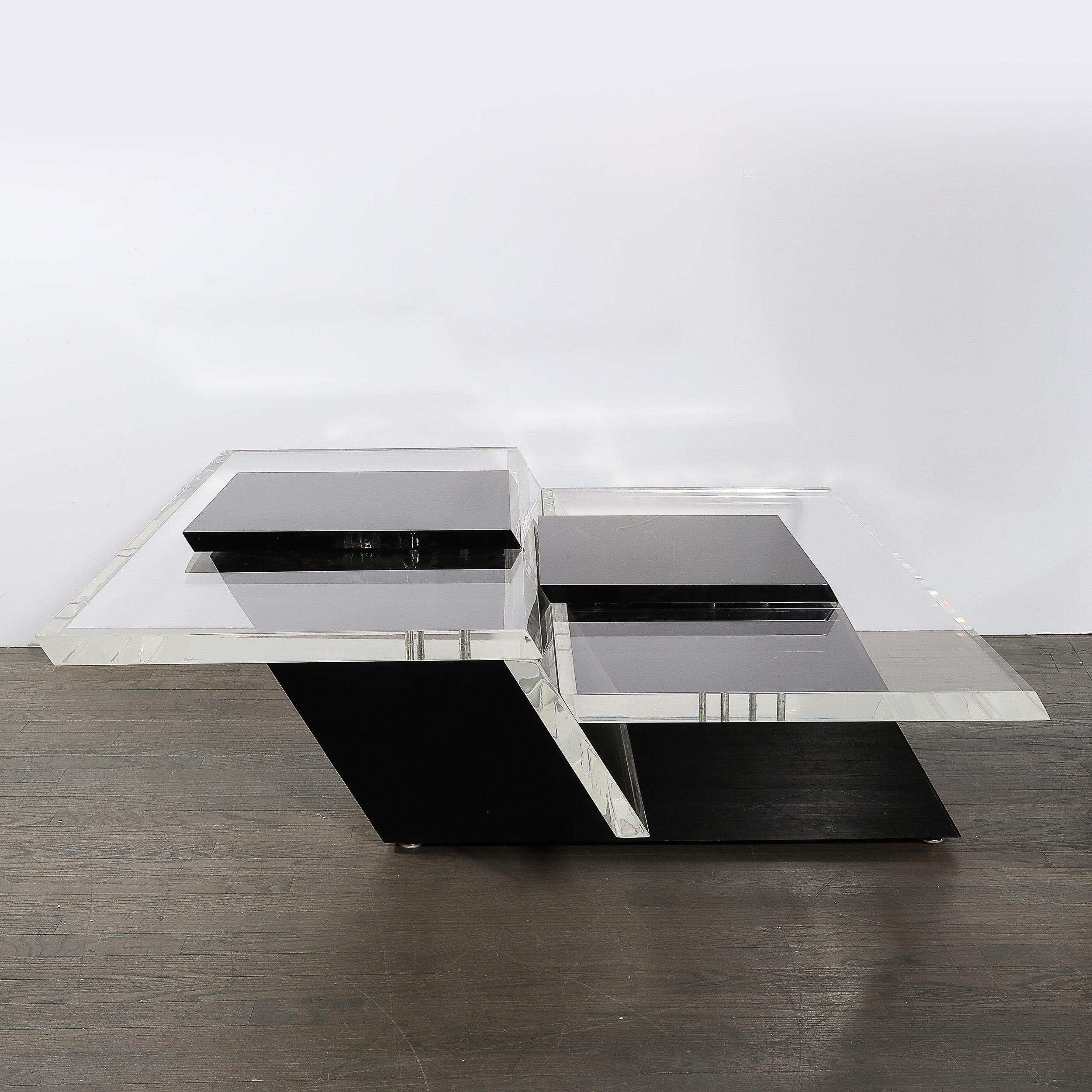 This boldly designed Mid-Century Modernist Two-Level Rectilinear Cocktail Table in Black and Clear thick  Lucite is crafted in the United States, Circa 1970. The table features a rectilinear design with clean, sharp lines that are emblematic of