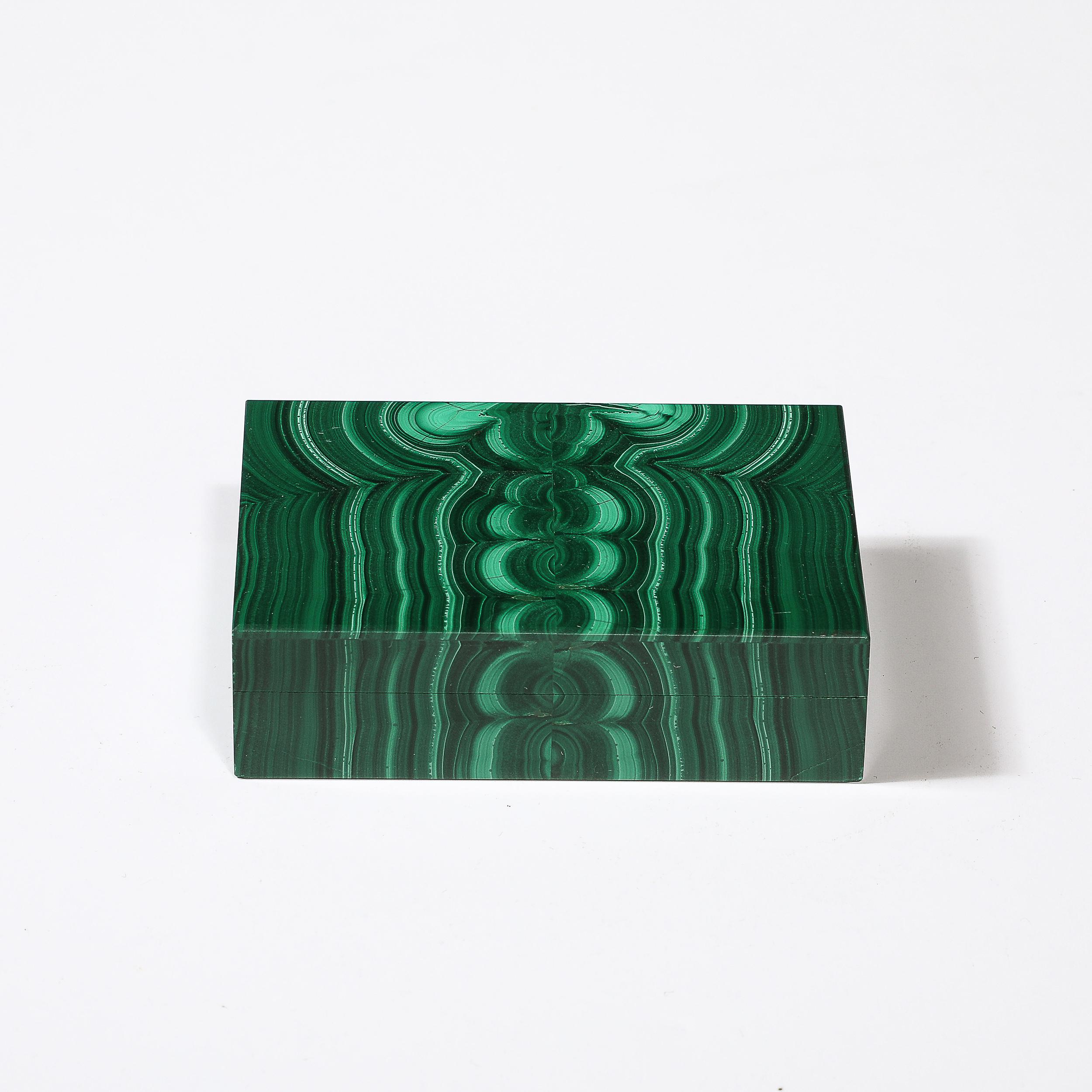 This stunning Mid-Century Modernist Bookmatched Malachite Box originates from the Russia, Circa 1970. Featuring a lovely textural surface composed of book-matched malachite, the material variation continues throughout the surfaces of the piece with