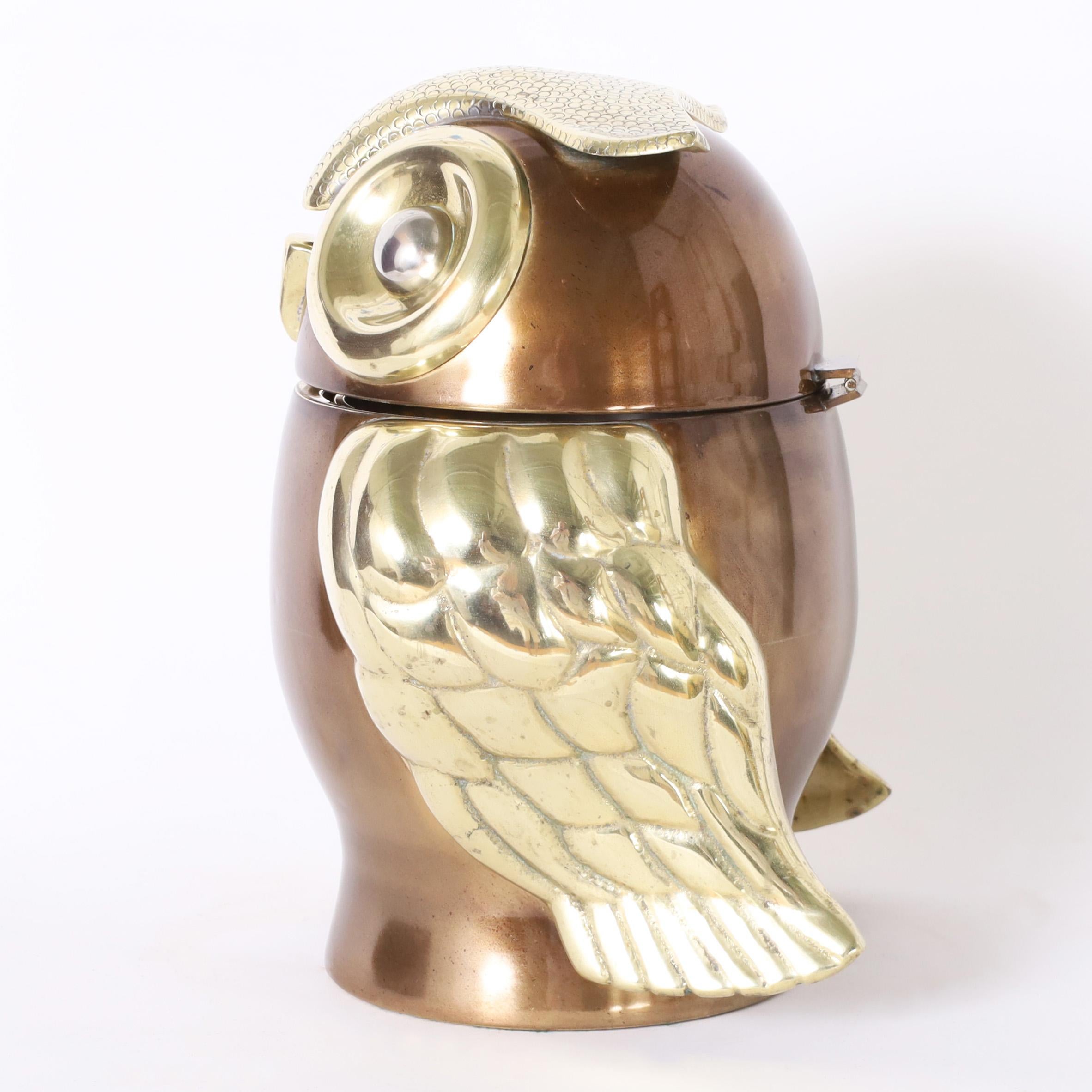 Striking vintage ice bucket with a stylized owl form hand crafted in brass, polished and with a patina, having silver plate eyes. Stamped Indugarcia Columbia on the bottom.