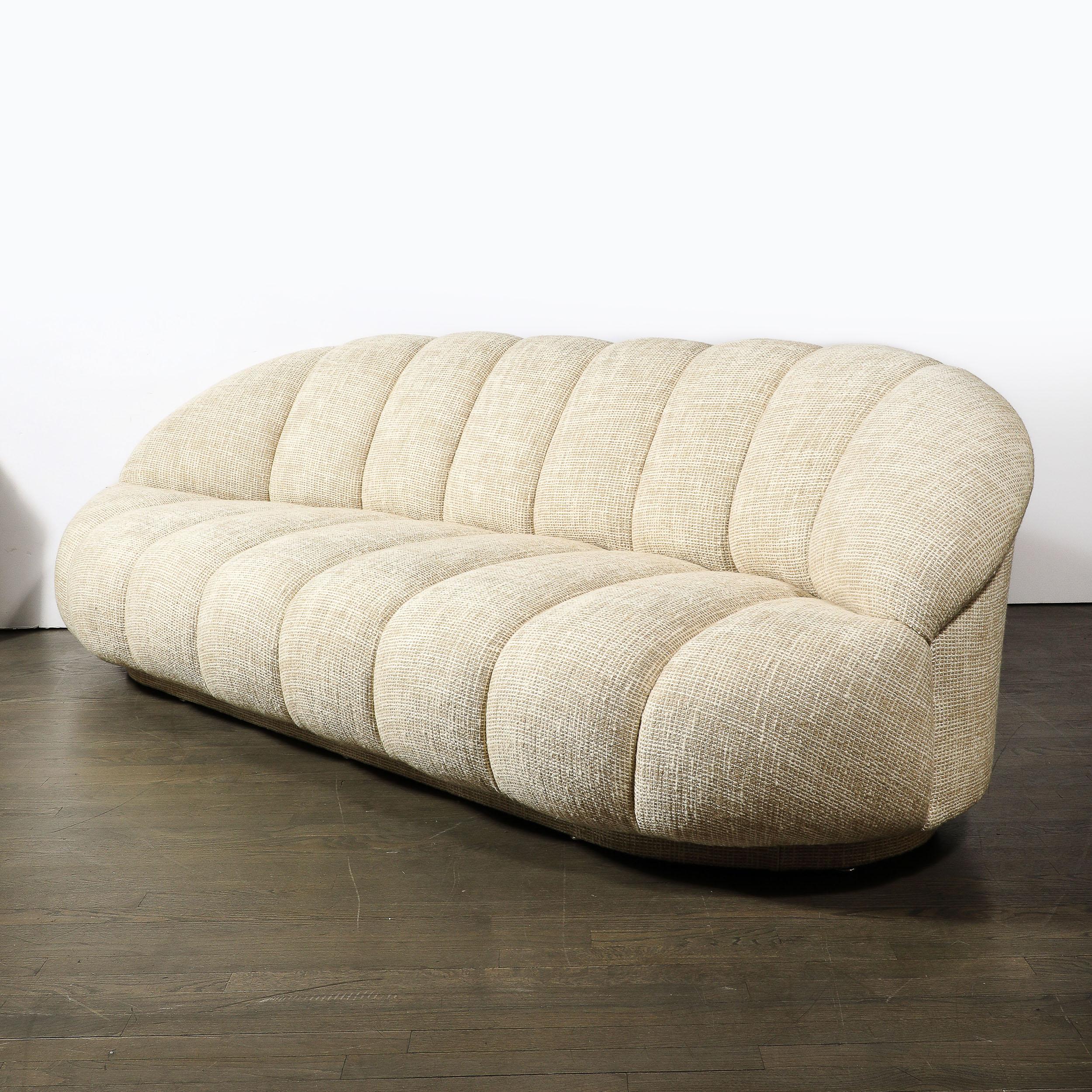 This sleek, playful, and beautifully proportioned Mid-Century Modernist Channel Form Cloud Sofa in Holly Hunt Fabric is by the esteemed furniture company A. Rudin and originates from the United States, Circa 1980. Features a rounded form with