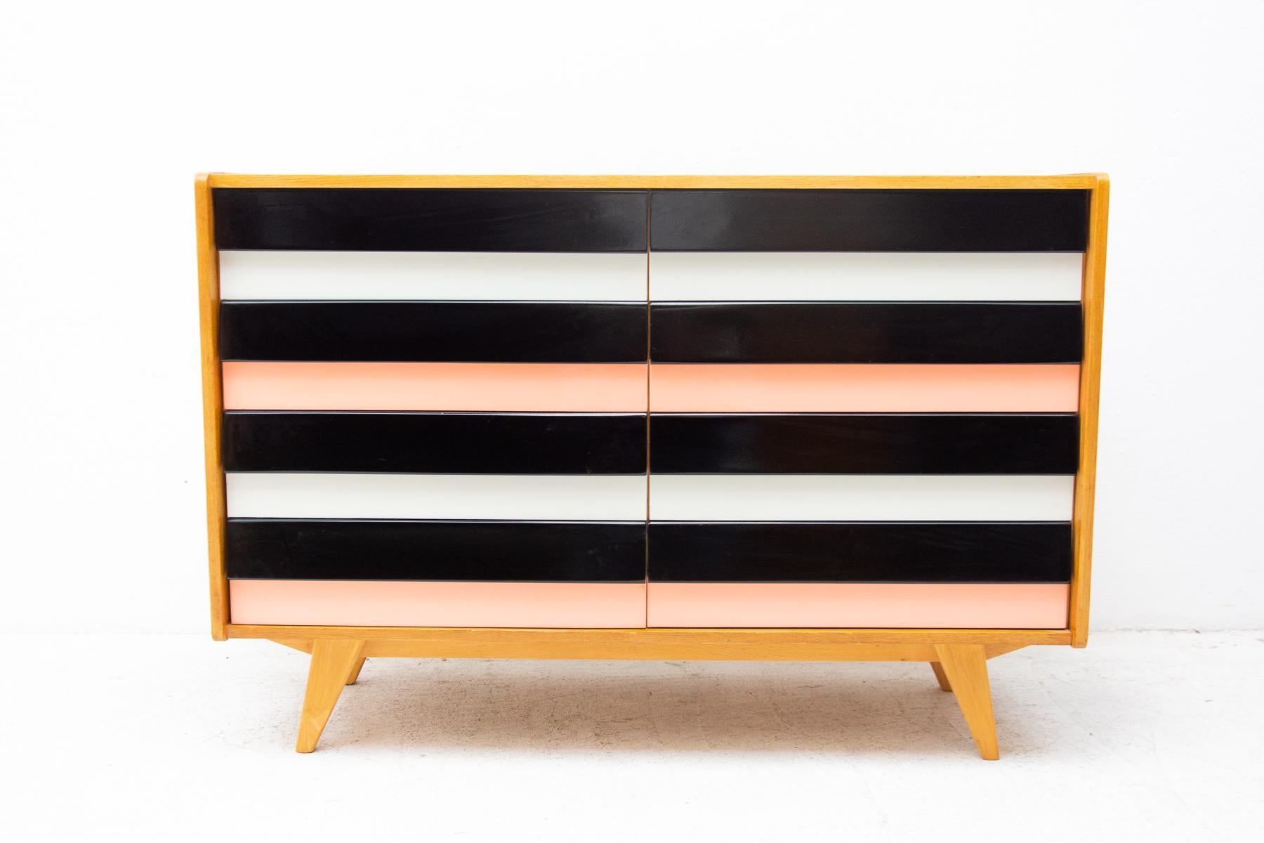 Modernist mahogany chest of drawers, model no. U-453, designed by Jirí Jiroutek for Interiér Praha. It was made in the former Czechoslovakia in the 1960´s. This model is associated with the world-famous EXPO 58 in Brussels. It features dark stained