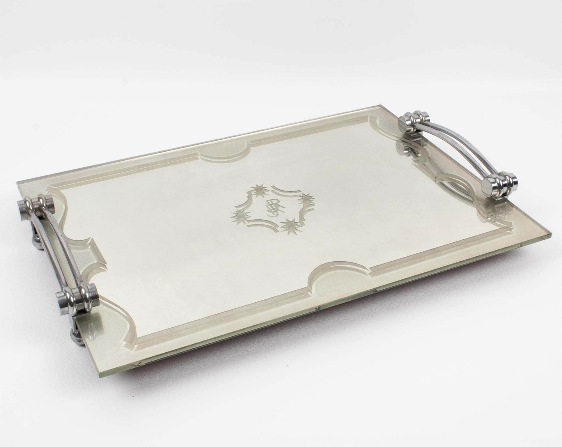 This lovely French modernist chromed metal and mirror tray features a thick mirrored glass slab with a frosted geometric design all around and a monogram engraved in the center reading 