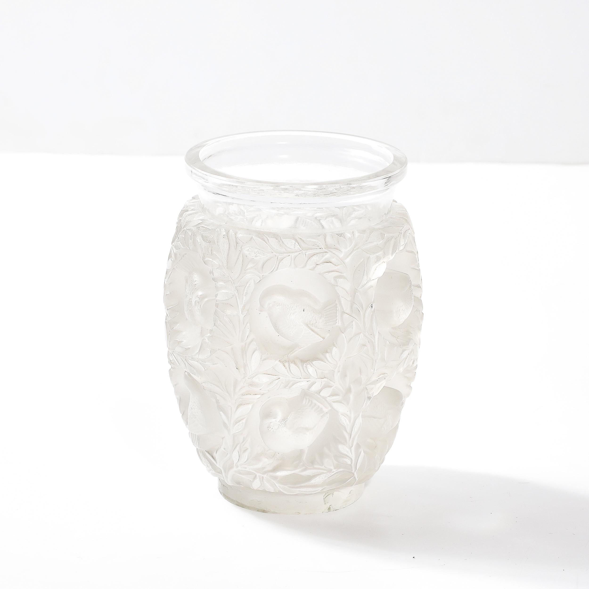 This stunningly designed Mid-Century Modernist Crystal Bagatelle Vase signed Lalique originates from France, Circa 1980. An emblematic piece by Lalique first designed in 1939, this vase is a brilliant combination of flora and fauna in a serene and