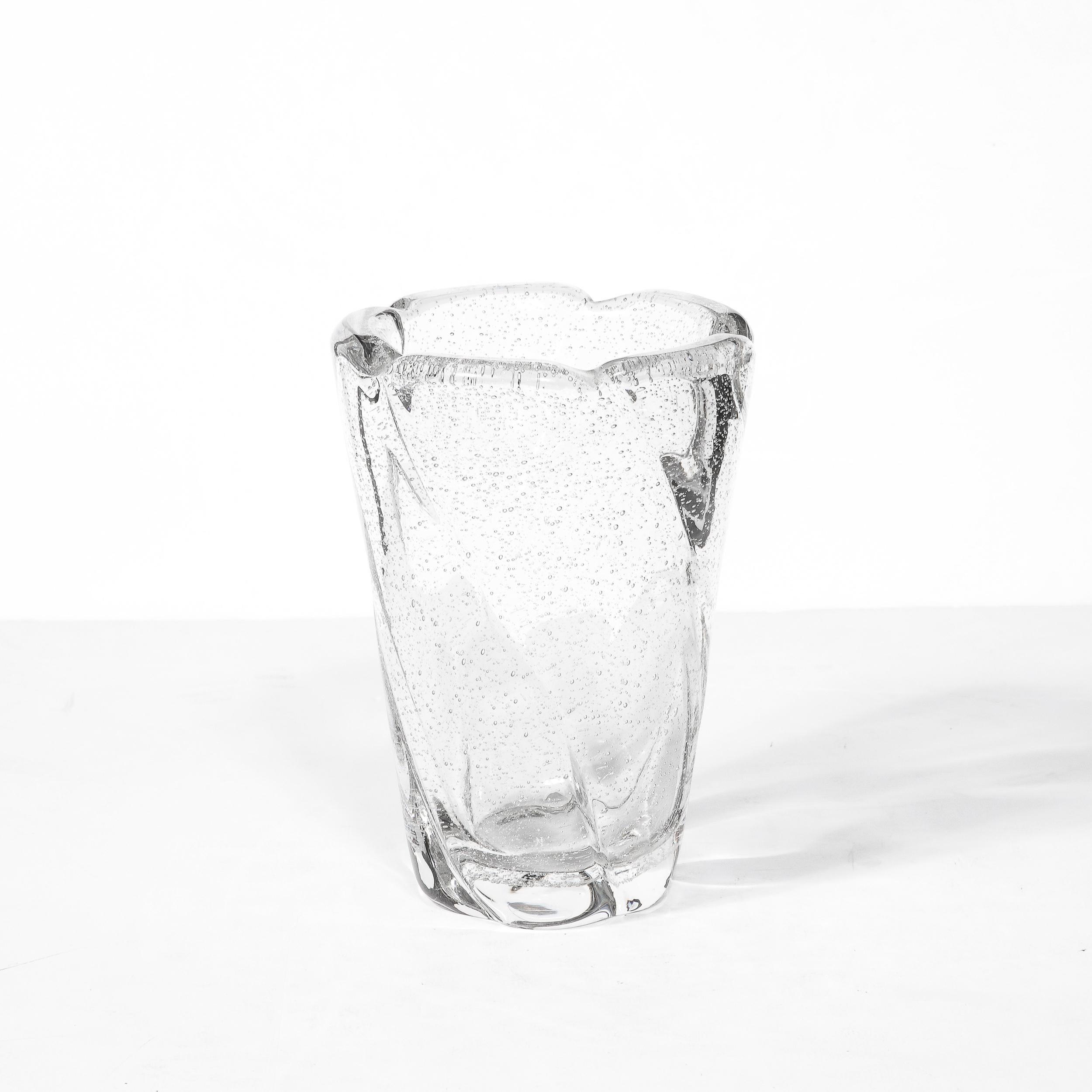 -This Mid-Century Modernist Crystal Vase by Daum originates from Nancy, France, Circa 1960. A lovely piece brimming with quiet energy, the vase features stunning murine detailing within the crystal and a gently curved spiral of groves gracefully