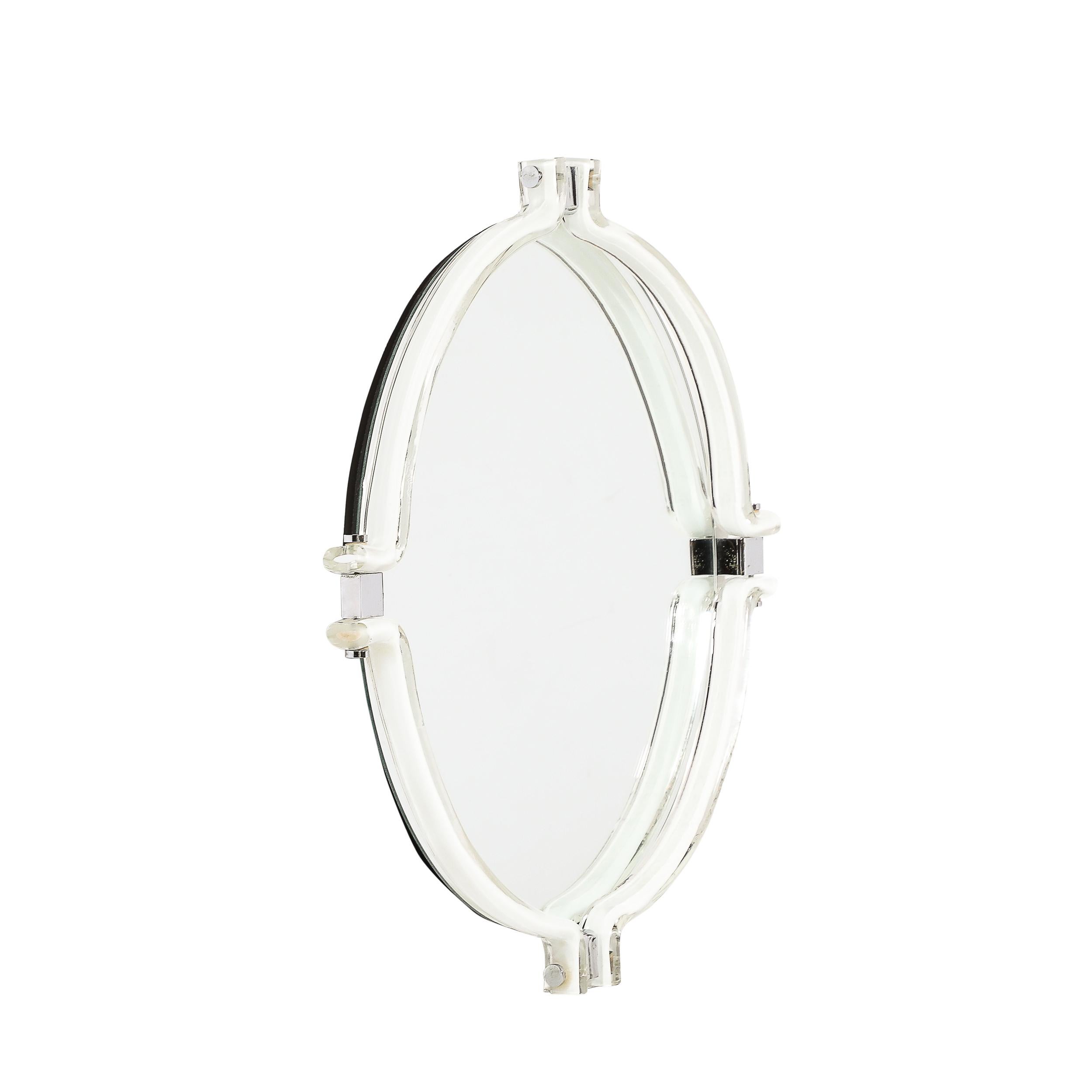 This unique Mid-Century Modernist Curved Hand-Blown Murano White Glass Mirror by Venini originates from Italy, Circa 1970. This piece features a round pane of mirror surrouded by a framework of hand-blown white murano glass elements. Each piece