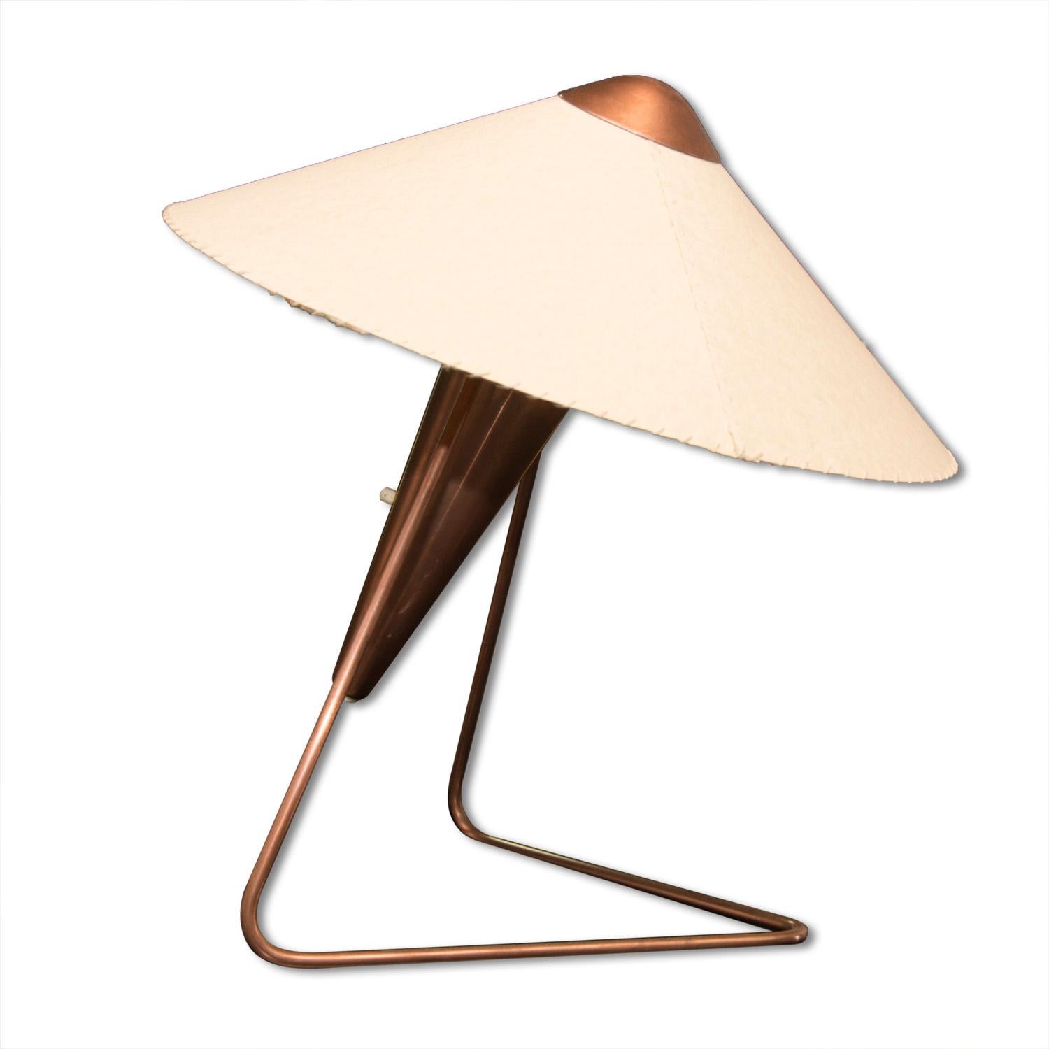 This brass copper-plated table or wall lamp was made in the 1950s in the former Czechoslovakia. It was designed by Helena Frantovat for Okolo company. It features a torch shaped design. This is a typical example of the modernist creation in