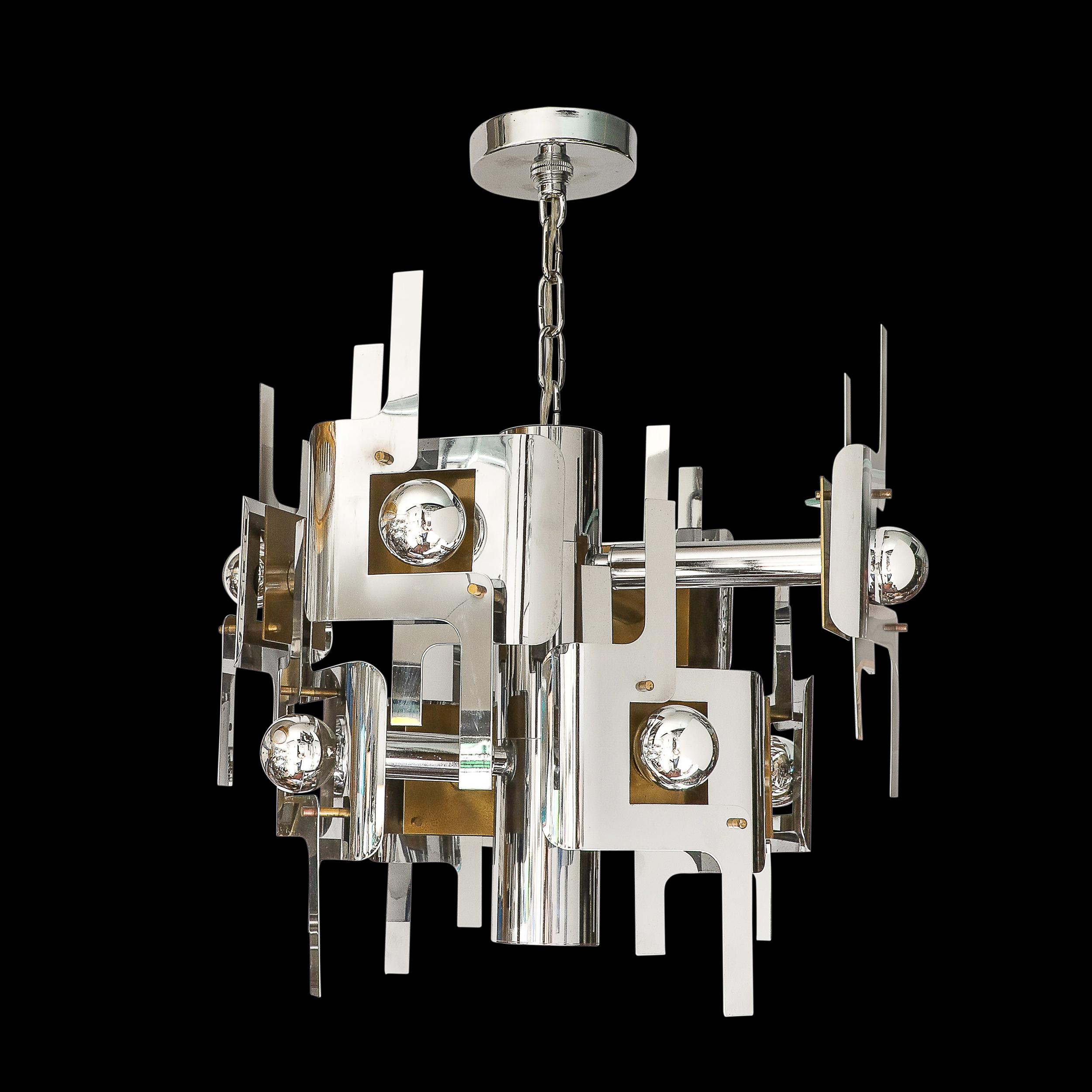 This stunning and materially dynamic Mid-Century Modernist Eight Arm Chrome & Brass Chandelier is by the esteemed designer Gaetano Sciolari. This piece originates from Italy, Circa 1970. Features a body formed from a vertical cyllinder of polished