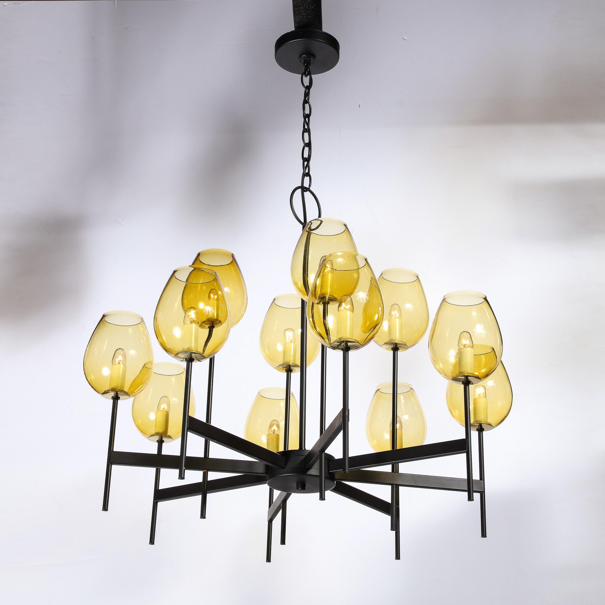 This elegant Modernist Eight Arm Chandelier in Black Enamel and Citrine Shades by Lightolier originates from the United States, Circa 1970. Features a delicate framework of supporting arms expanding from the central rod in beautifully delicate