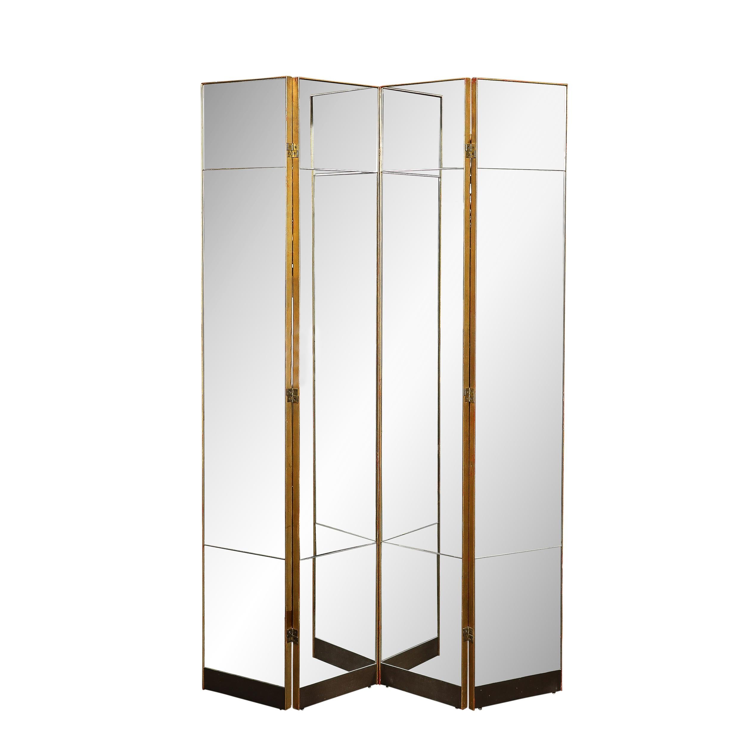 This sleek and beautifully formed Mid-Century Modernist Four Panel Mirror Screen W/Antique Gilt Wood Detailing originates from the United States, Circa 1970. Featuring four panels in total with three sections of glass in each panel. The seams