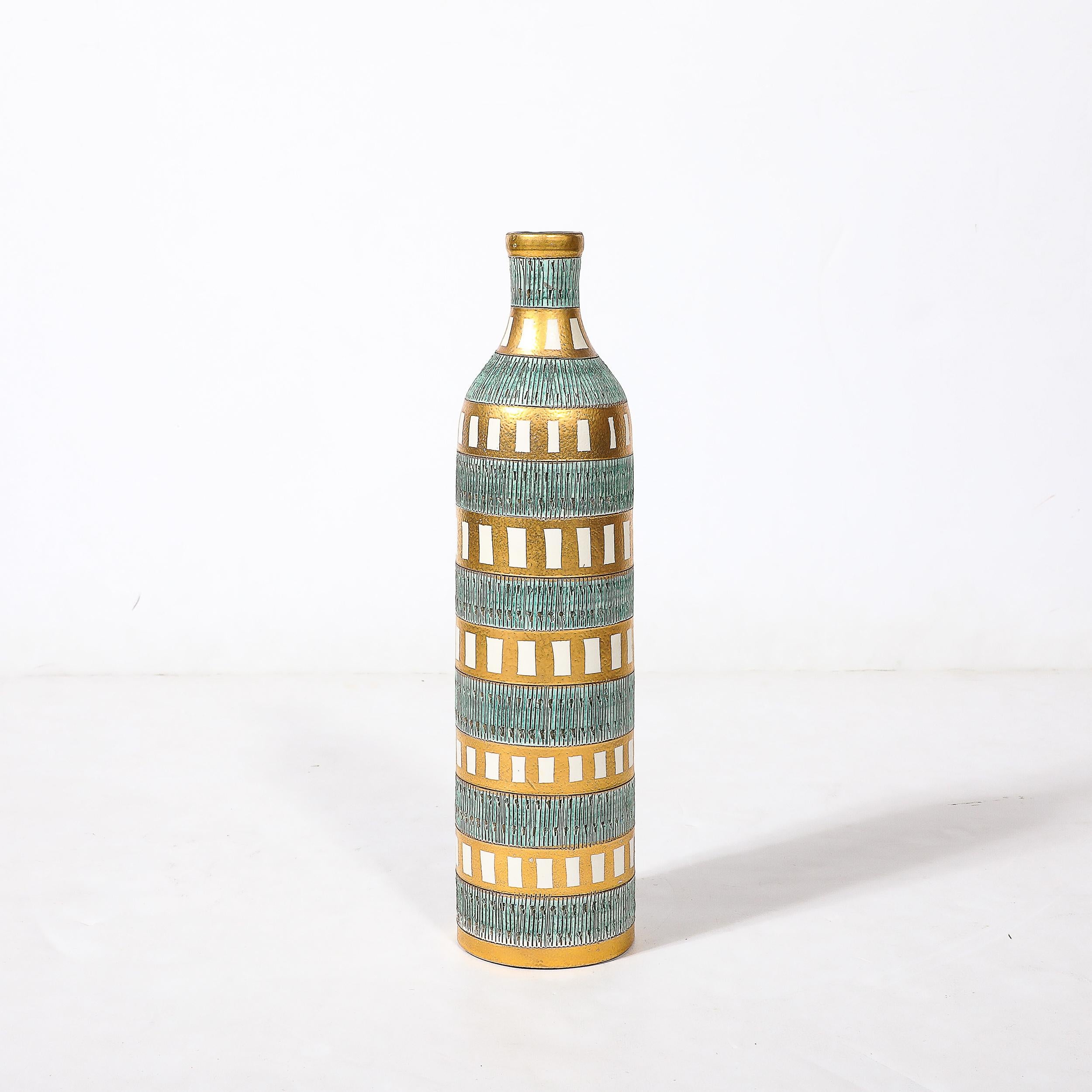 This beautiful and charming Mid-Century Modernist Bitossi Seta Ceramic Vase W/Geometric Banded Motifs in Turquoise and Gilt Glaze is by the esteemed ceramicist Aldo Londi and originates from Italy, Circa 1950. Features stunning banded motif with
