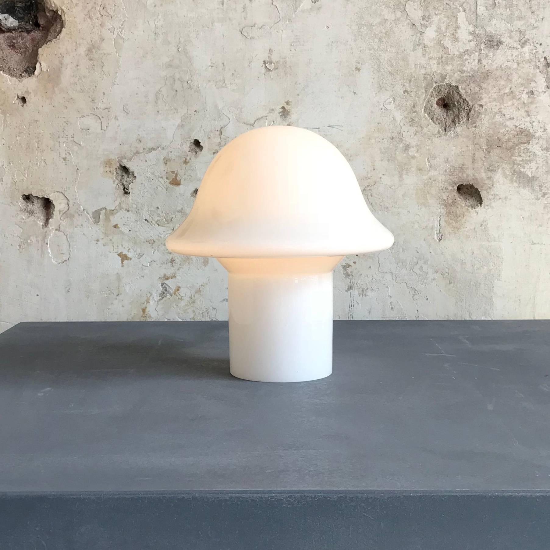 Remarkable, beautiful Mid-Century mushroom table lamp by Peill & Putzler, Germany, 1970s. Made of a single piece of handblown and cased glass.
Original wiring with nice on-off switch and European plug.
Manufacturers label on the original E14