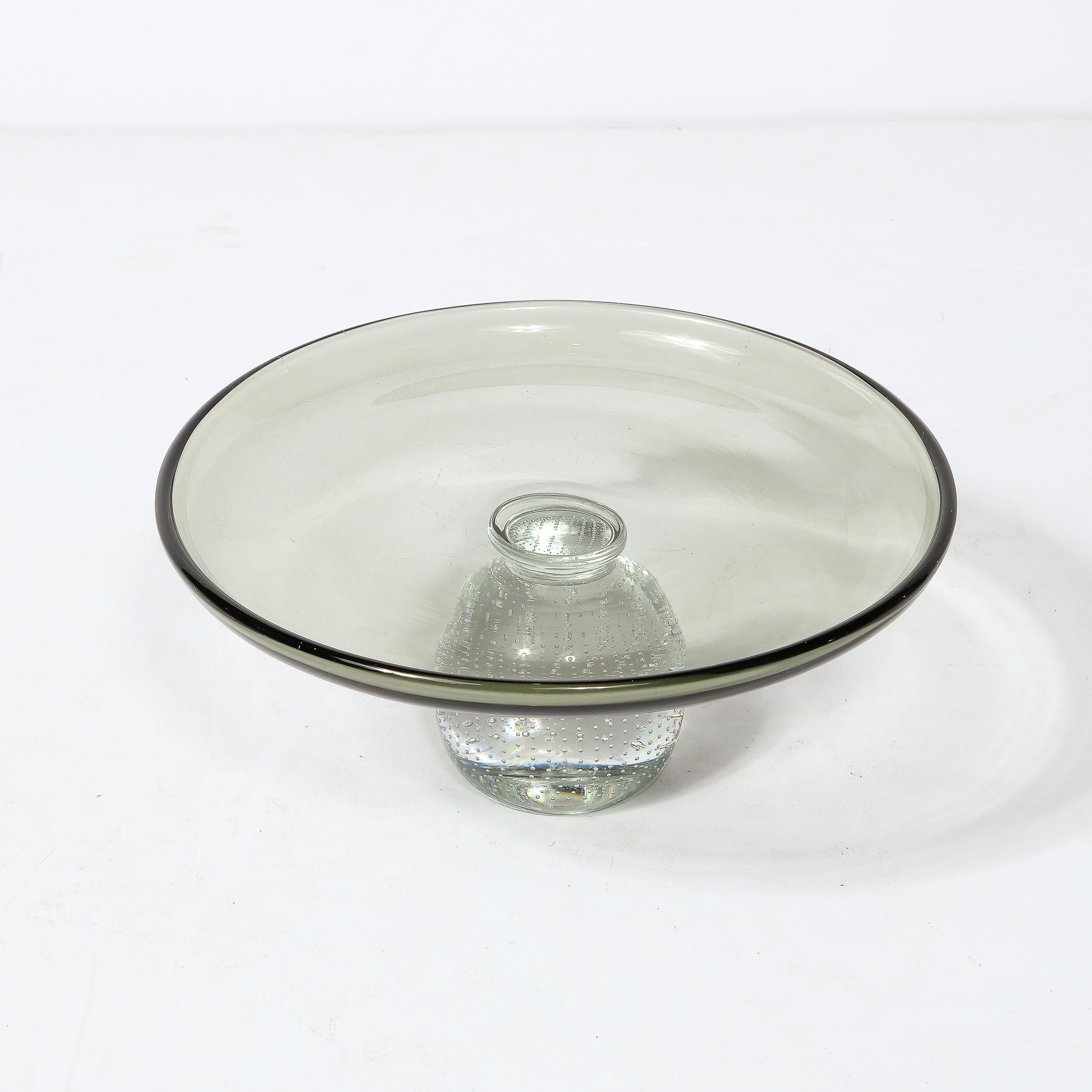 This Hand-Blown Glass Centerpiece/ tazza  originates from the United States Circa 1950. Composed in smoked semi-translucent glass with a raised lip supported by a base detailed in numerous stunning and evenly spaced murines. The glass is excellent