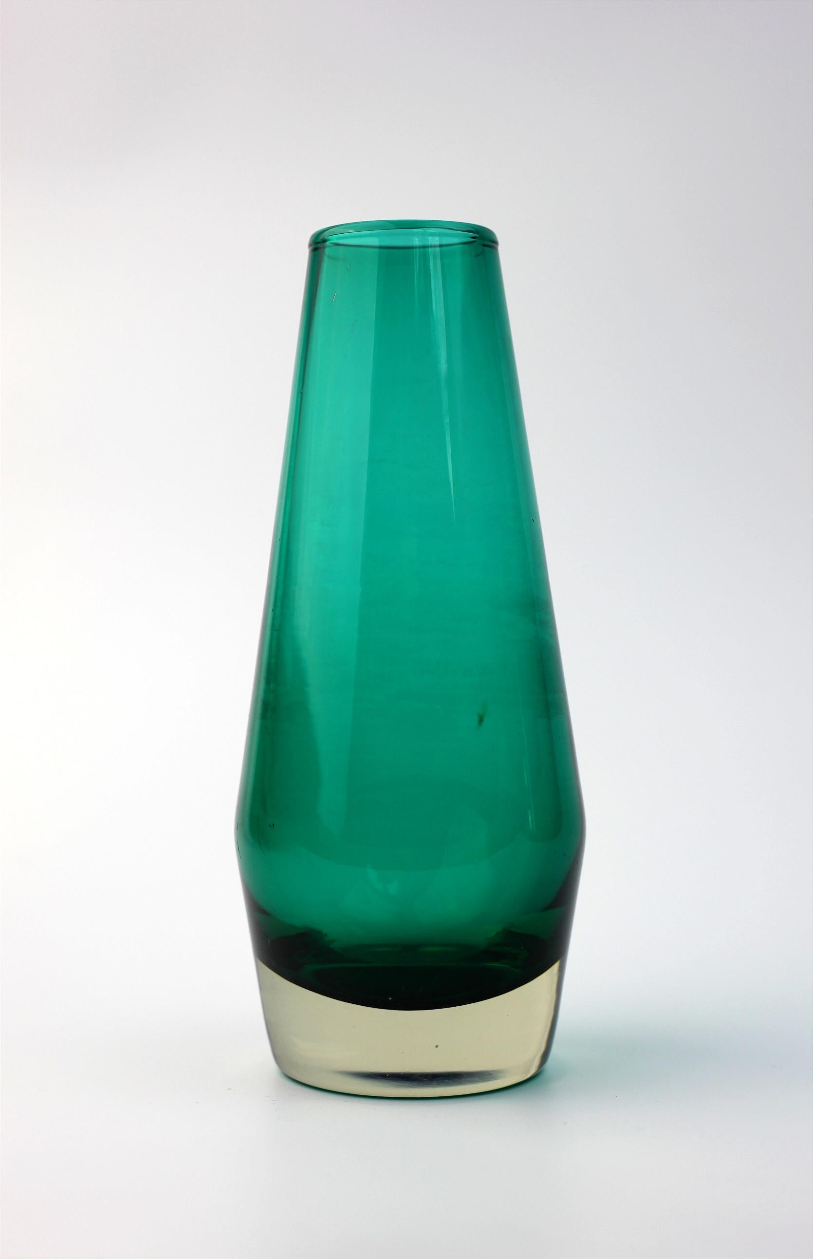Nice Turquoise Glass vase by Tamara Aladin from Finland

It is around 16 cm tall 
and 7 cm wide.