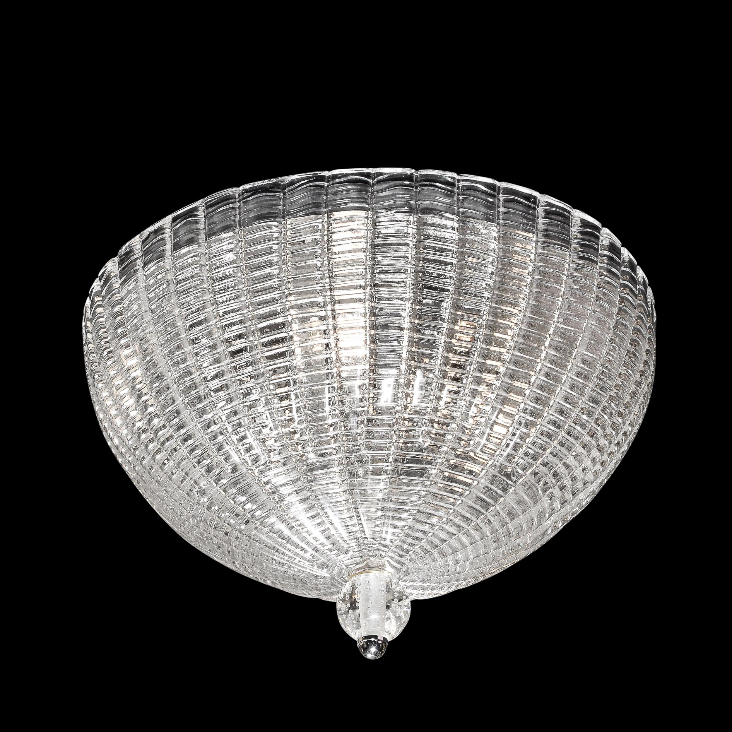 This stunning modernist flush mount was realized in Murano, Italy- the island off the coast of Venice renowned for centuries for its superlative glass production- during the latter half of the 20th century. Executed in the manner of the fabled