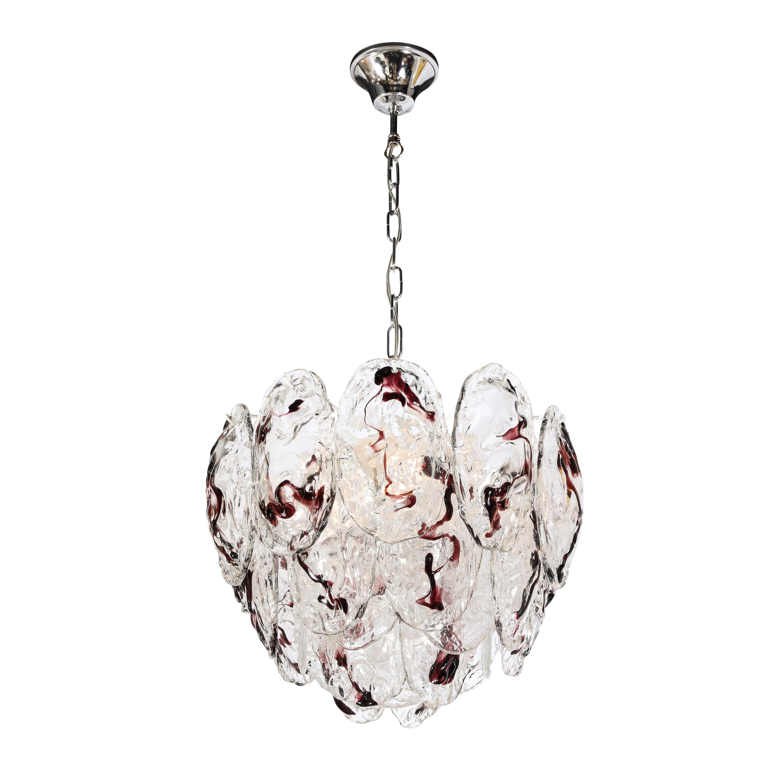 This elegant and mysterious Mid-Century Modernist Hand-Blown Murano Glass Chandelier by Mazzega originates from Italy, Circa 1970. Features hand-blown oval shaped mottled glass shades. Each is translucent with lovely textural variation. Each shade
