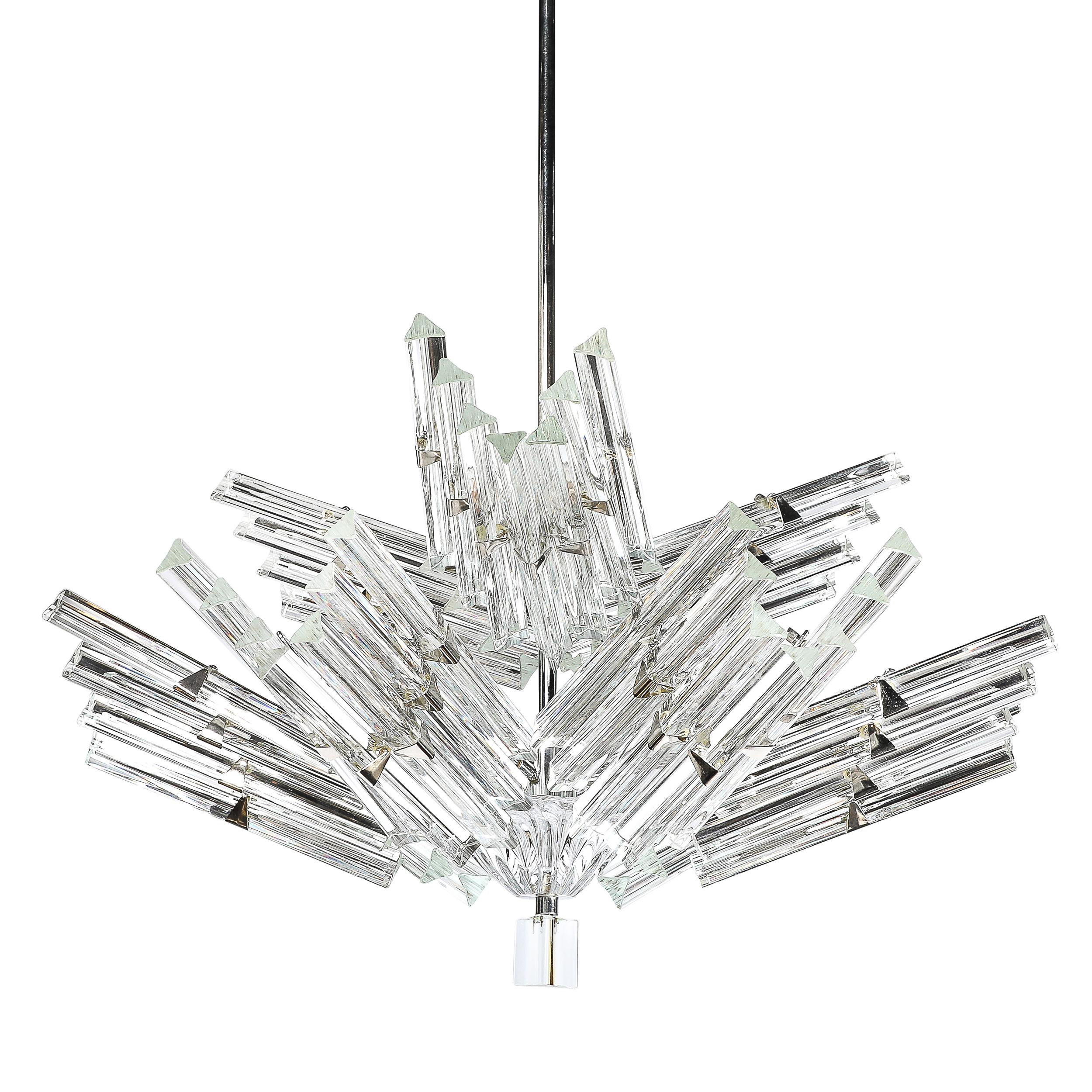 This uniquely bold and elegant Mid-Century Modernist Hand-Blown Murano Stepped Cluster Triedre Chandelier with chrome Fittings originates from Italy, Circa 1970. Features a highly geometric and expansive form composed of stepped clusters of