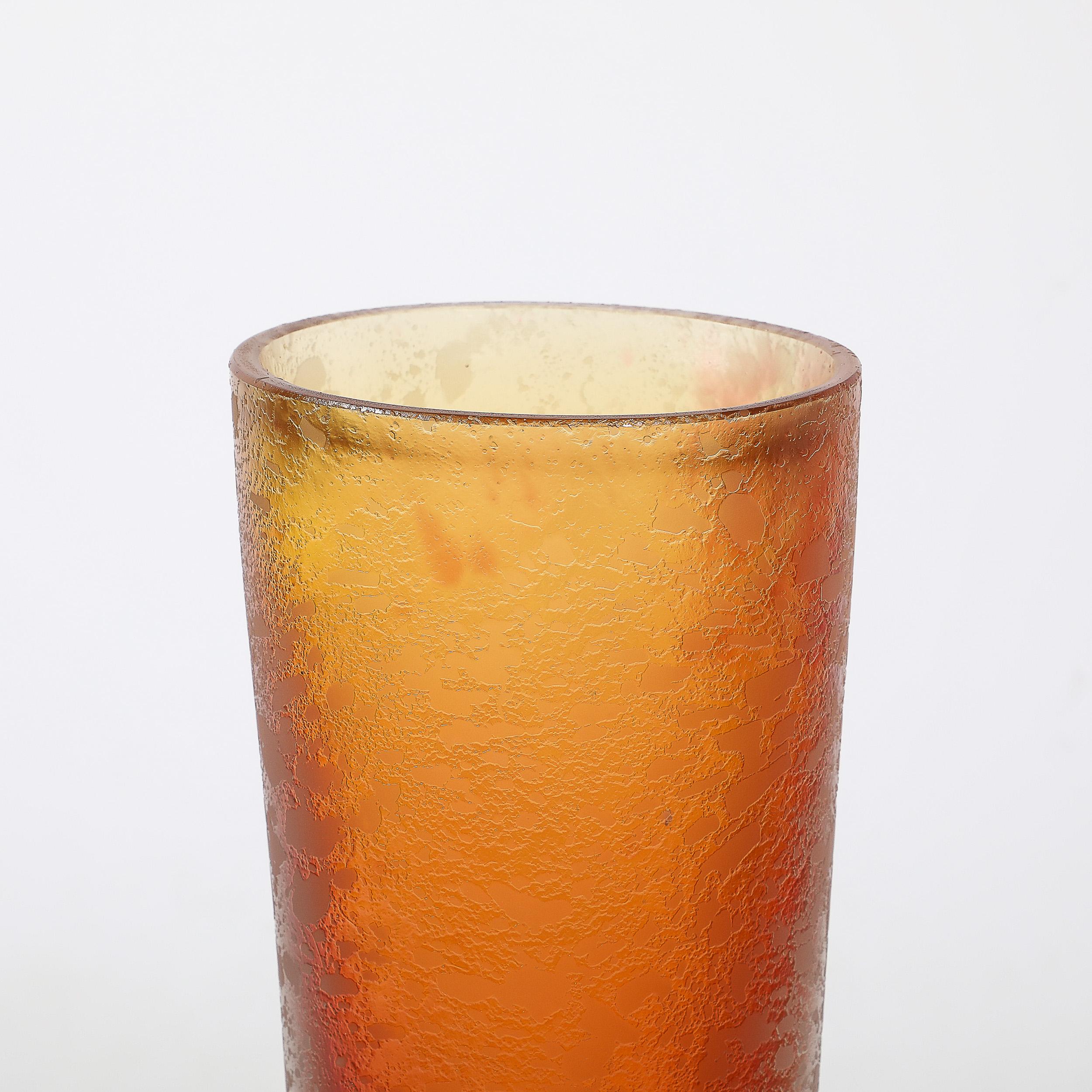 This stunning Mid-Century Modernist vase, crafted in Murano, Italy circa 1960, showcases the impeccable artistry synonymous with Murano glassmaking. The hand-blown glass is rendered in a soft apricot hue, exuding warmth and subtle sophistication.