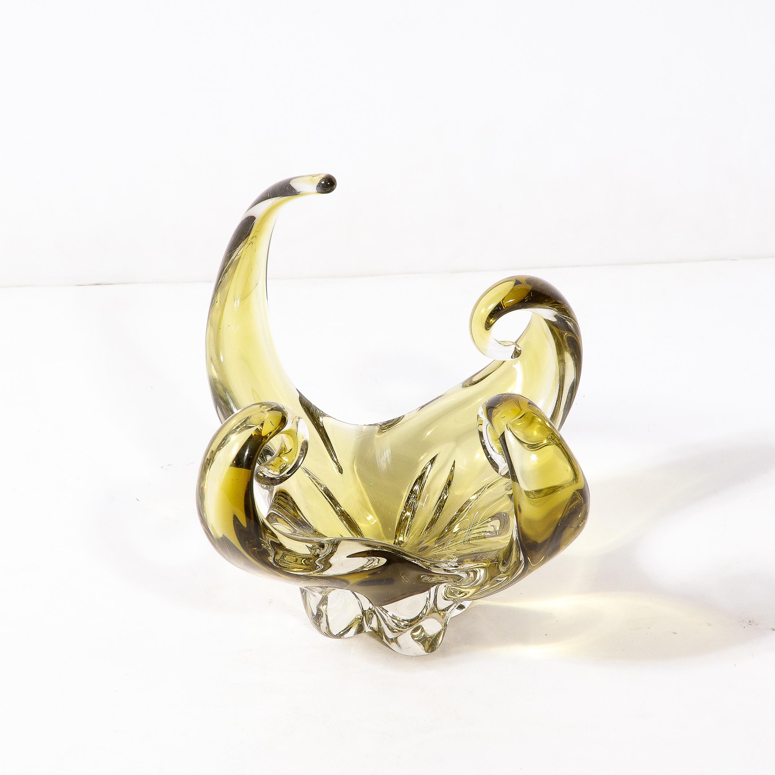 -This beautiful Mid-Century modernist Murano glass centerpiece is rendered in a lovely smoked citrine  and originates from Italy, Circa. 1960. Featuring a series of elongated arms coiling inwards, one expands elegantly creating dynamism and intrigue