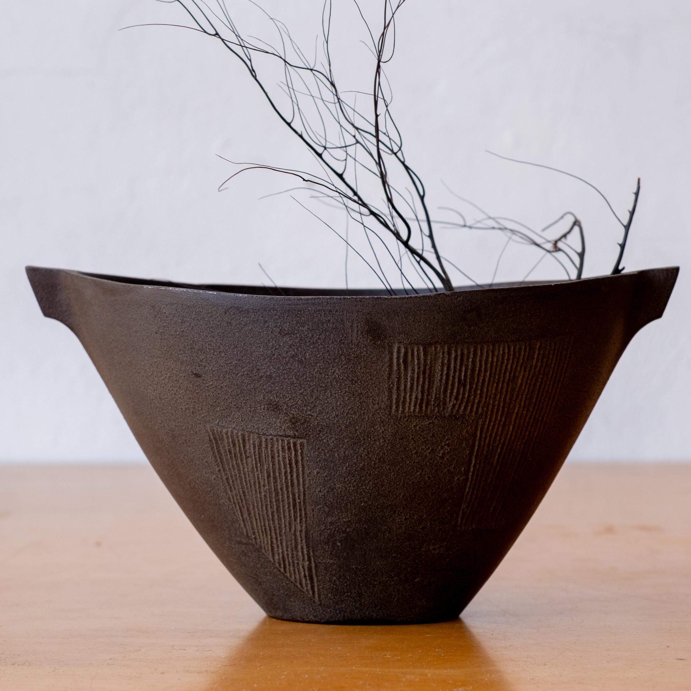 Mid-Century Modernist cast iron Ikebana vase or planter from Japan. Abstract incised design on a beautiful form. 1950s