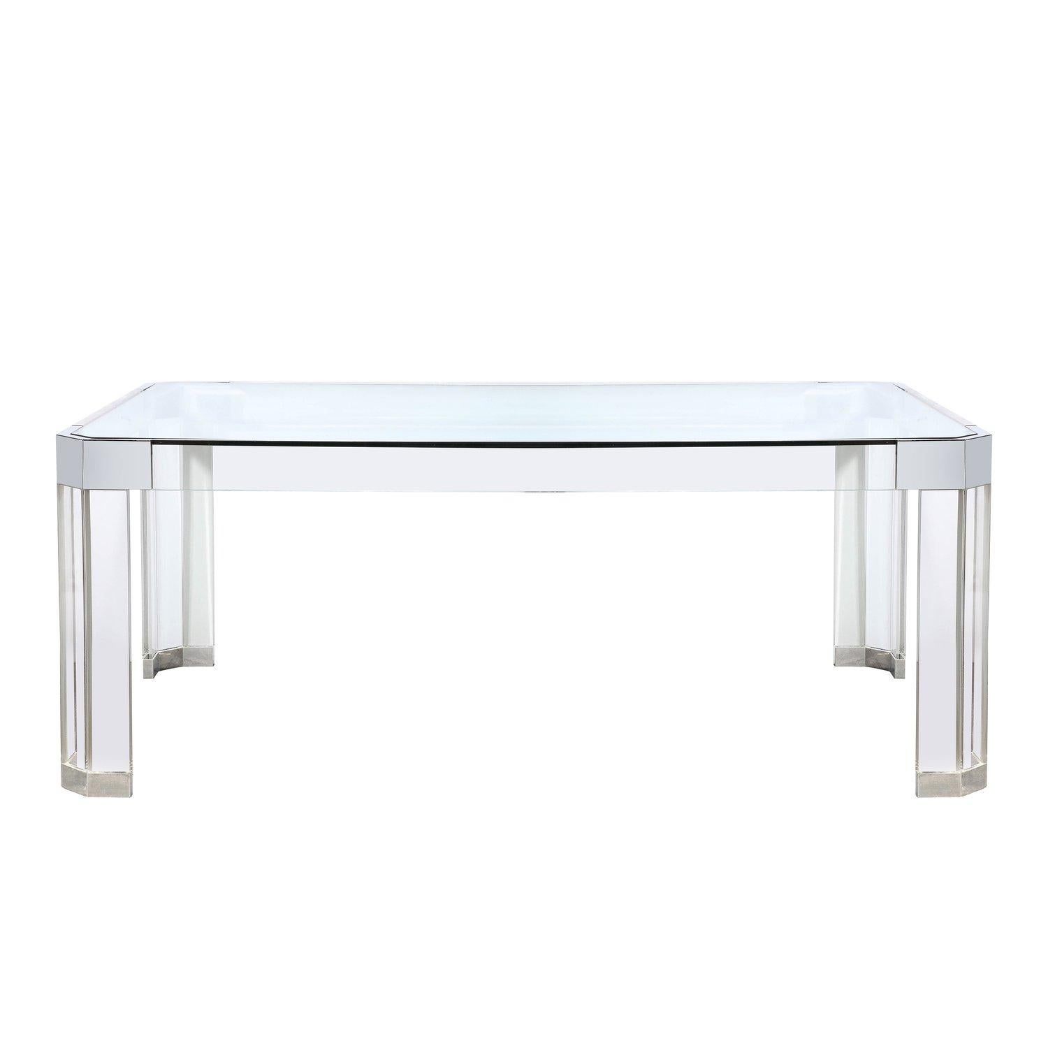This stunning Mid-Century Modernist Lucite and Chrome Dining Table is by Charles Hollis Jones and originates from the United States, Circa 1970. Features an elongated rectangular profile with an inset glass top resting on beautifully fabricated