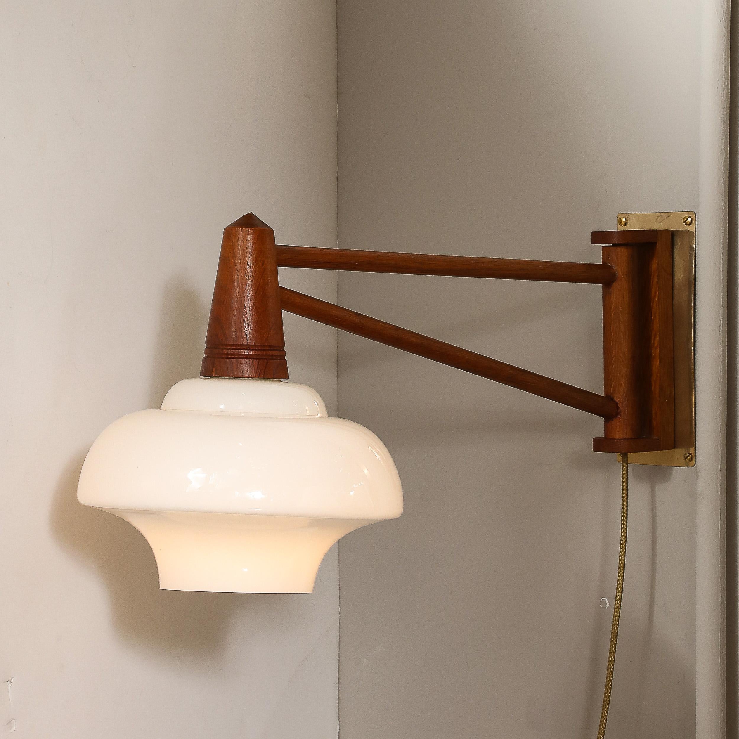 Danish Mid-Century Modernist Milk Glass & Teak Swing Arm Wall Sconce W/ Brass Fittings For Sale