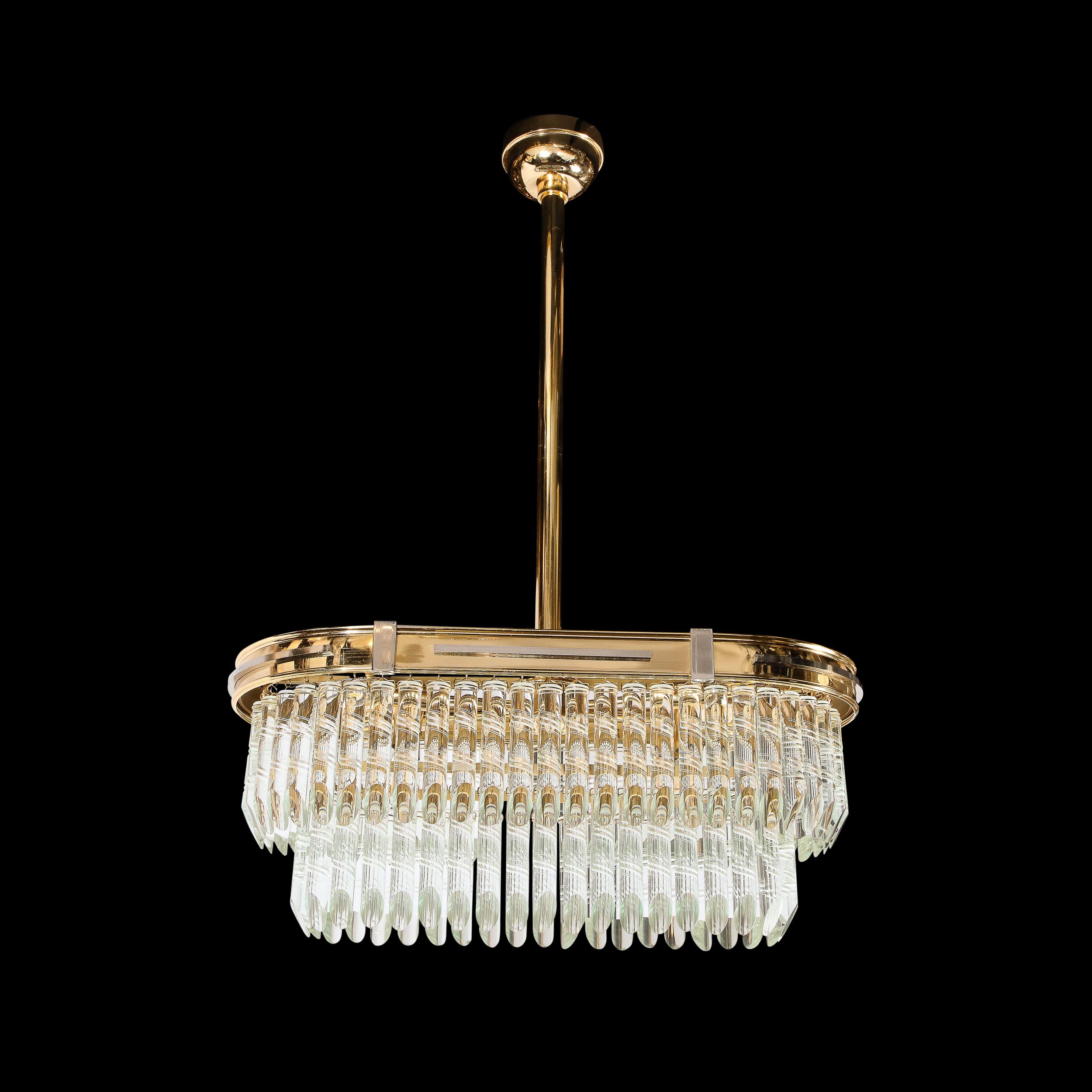 The chandelier originates from Italy circa 1970. Features an oblong geometric frame composed in polished brass, with rectilinear nickel detailing, cleverly, placed within the frame and rewarding further viewing and detailed observation, hanging from