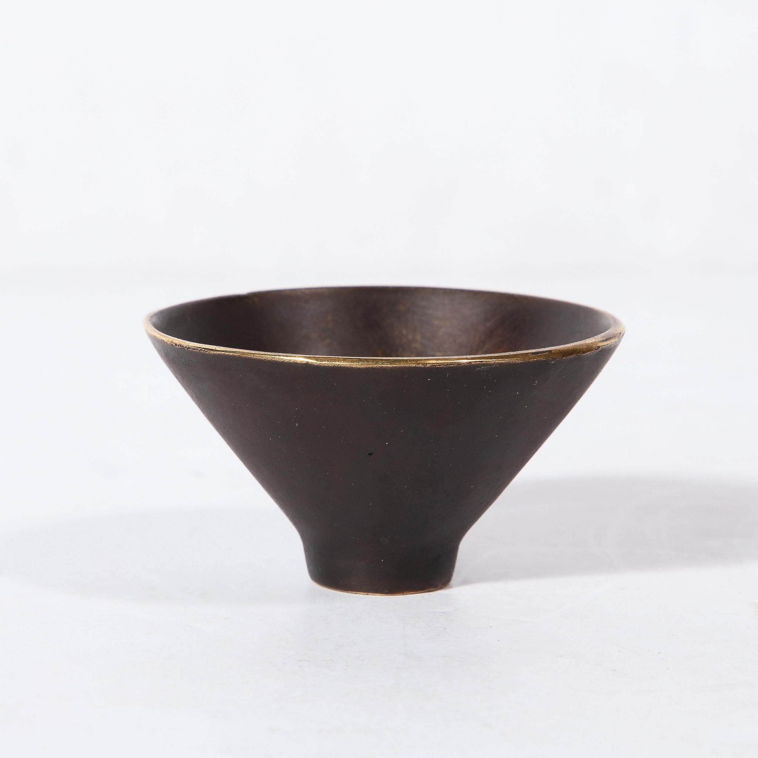This stunning and minimal Mid-Century Modernist patinated Brass Conical Dish was made by the esteemed artist Carl Aubock and originates from Austria, Circa 1950. Features a subtle conical composition rendered in a matt black enamel with an exposed