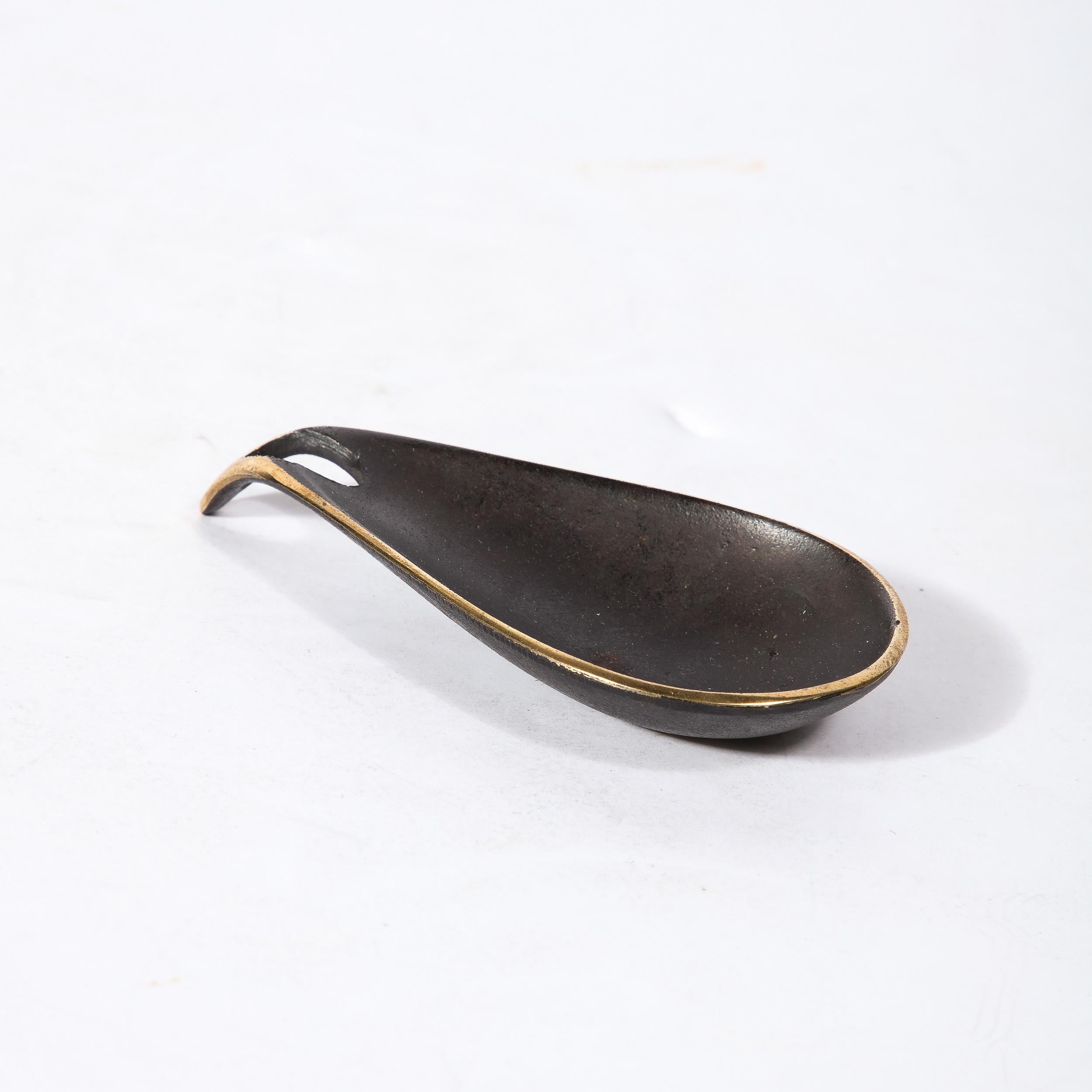 This beautifully designed Mid-Century Modernist patinated brassl Teardrop Dish was made by the esteemed artist Carl Aubock and originates from Austria, Circa 1950. Featuring a construction in black patination with exposed polished brass