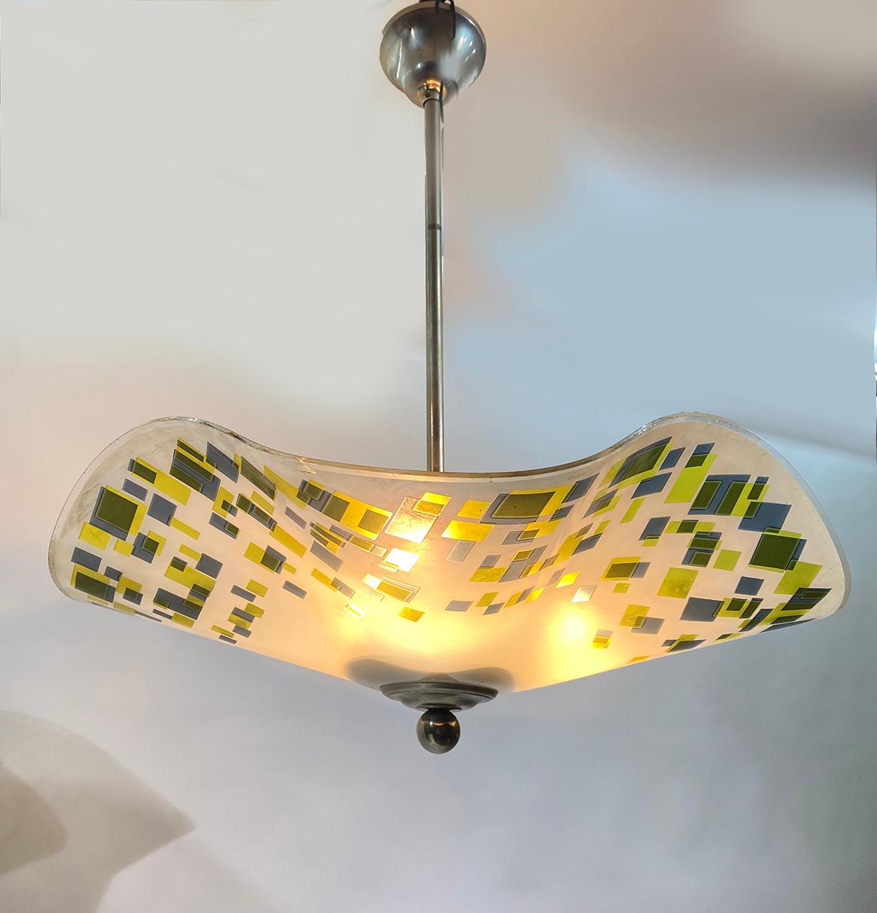 Large mid century French Art Deco pendant chandelier, circa 1930s.
Colorful lampshade hung on its nickel-plated fixture.
Delivered and wired for American or European use.
Slight damage on the border of glass without fracture. 